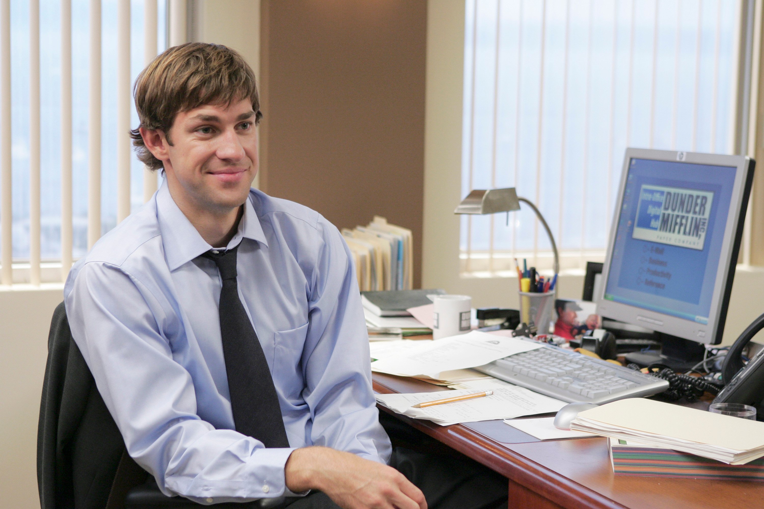John Krasinski as Jim Halpert in a moment at his Stamford desk from season 3 of 'The Office'
