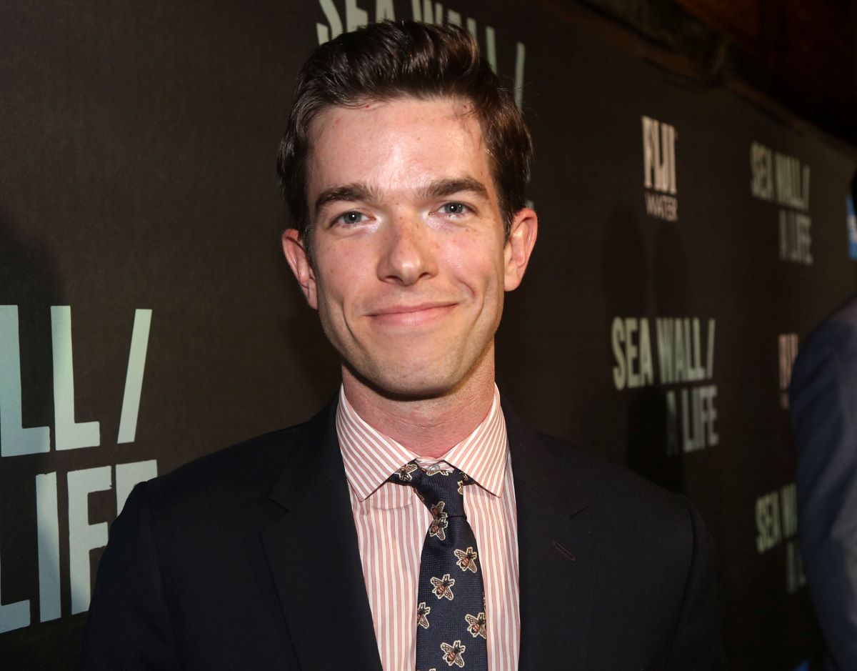 John Mulaney in jacket and tie