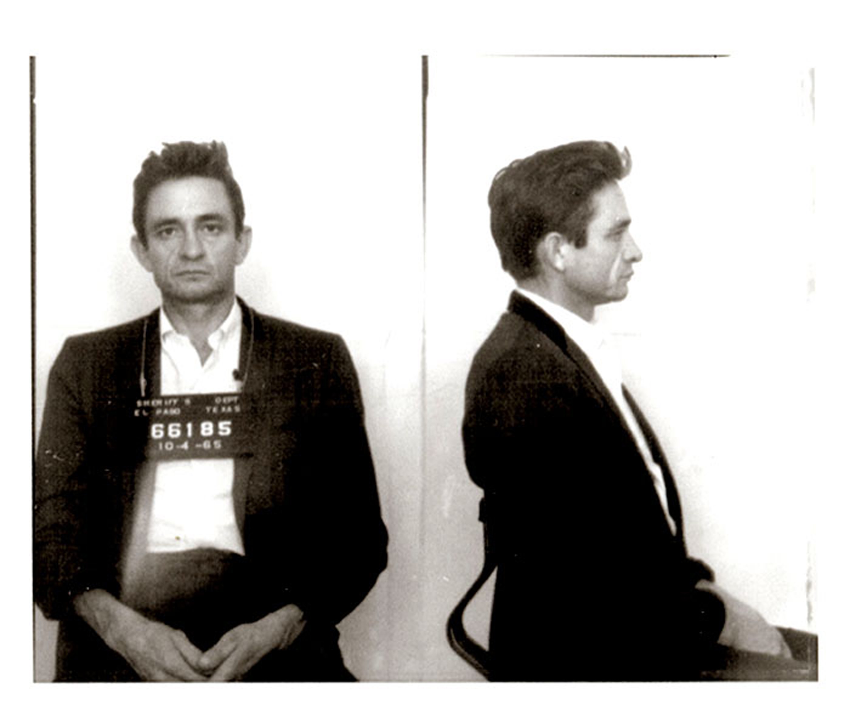 Johnny Cash poses for a mug shot after his 1965 arrest.