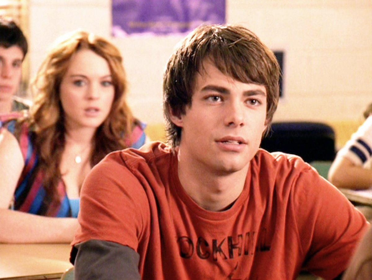 Jonathan Bennett and Lindsay Lohan sitting in a classroom during a scene in the movie "Mean Girls."