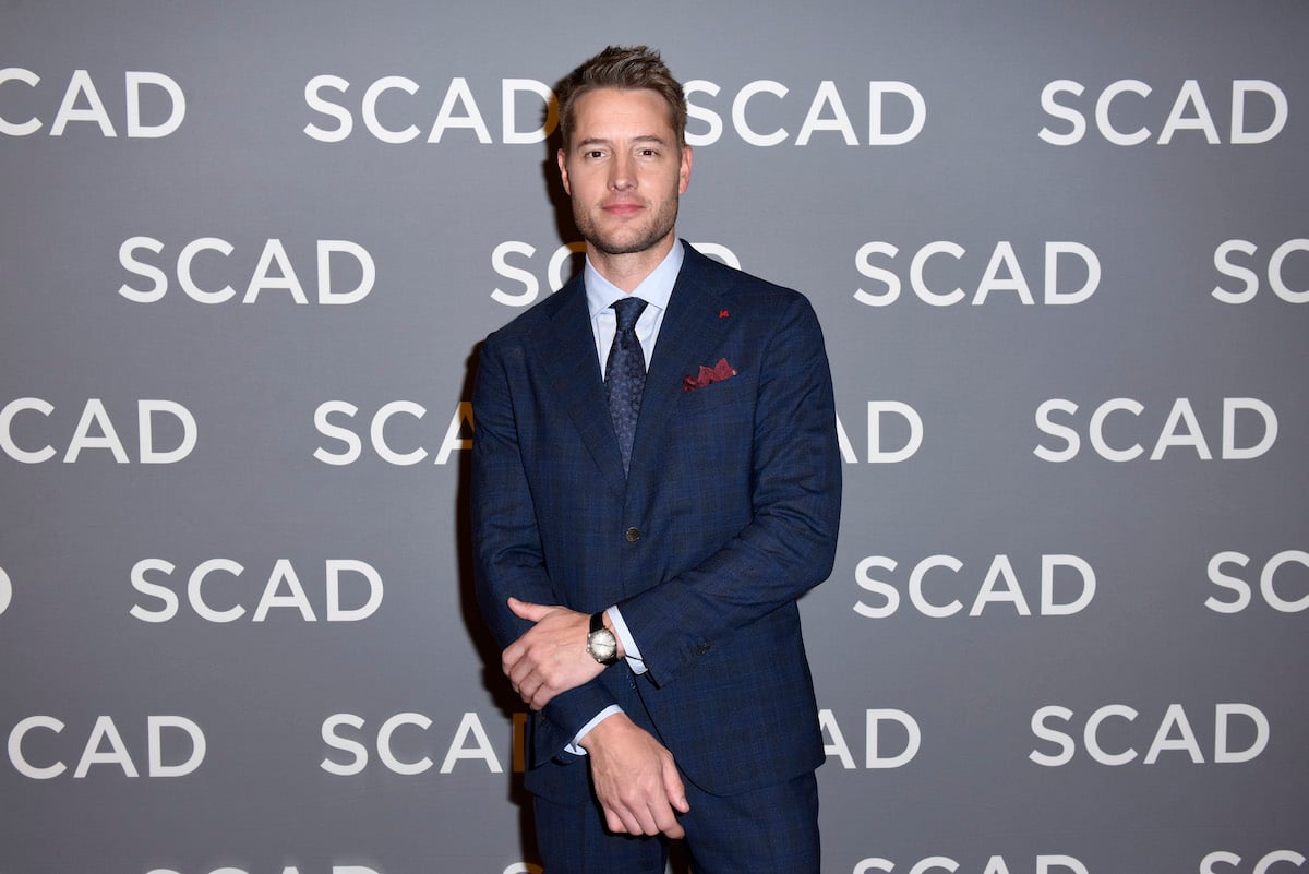 Justin Hartley wears a grey suit on the red carpet