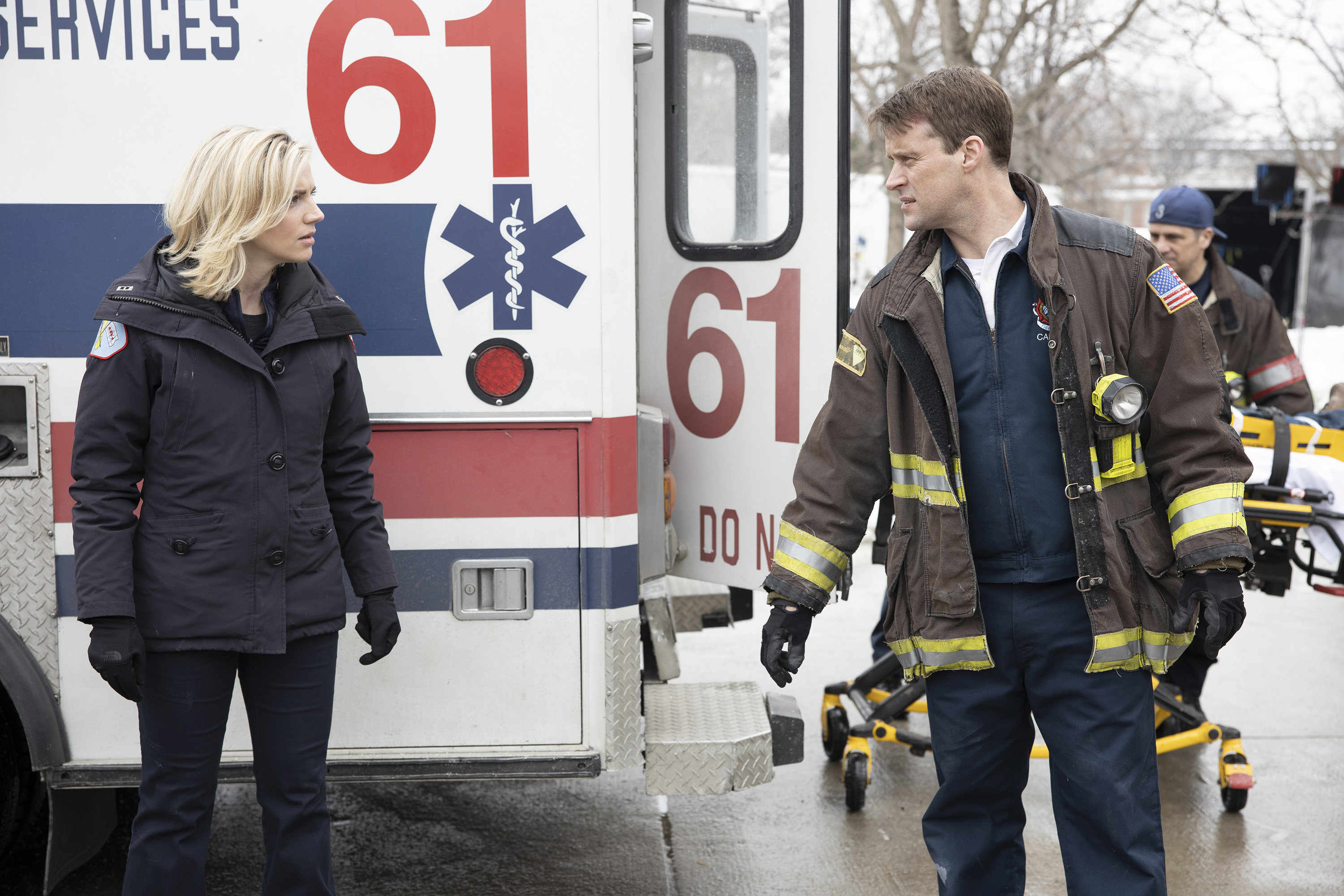 Sylvie Brett and Matt Casey standing in front of an ambulance on 'Chicago Fire'