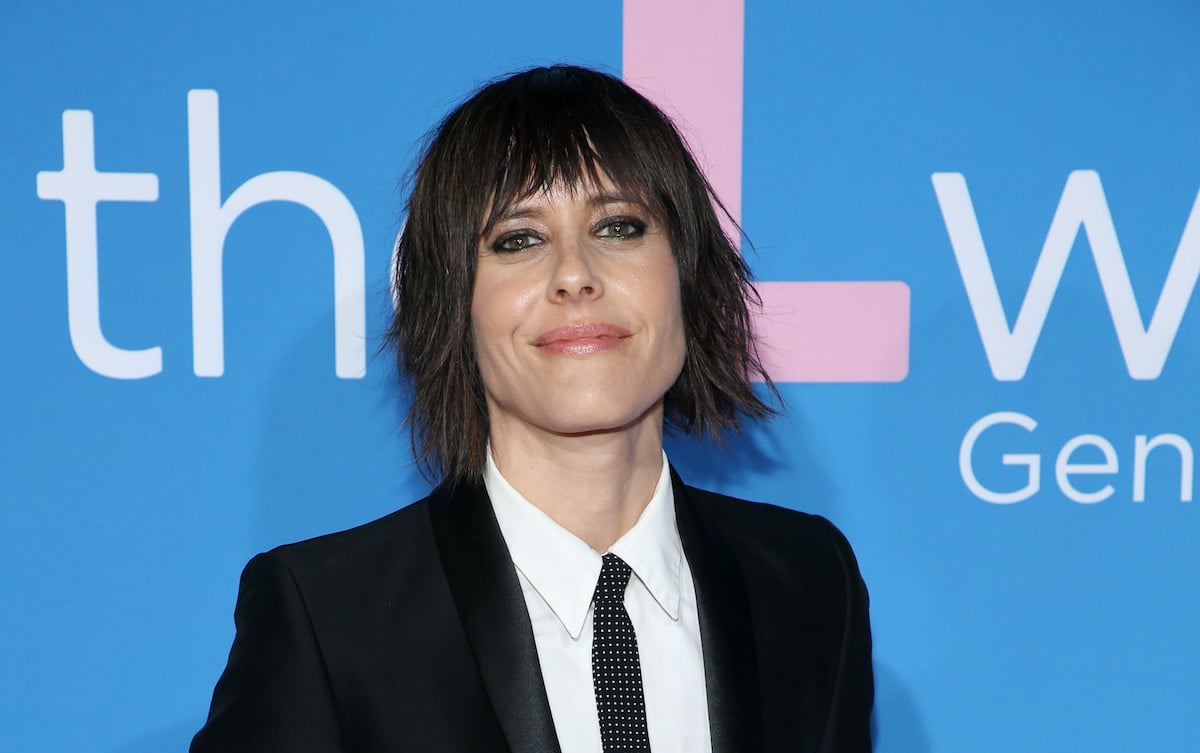 Katherine Moennig wears a dark suit on the red carpet at an event for the Showtime series 'The L Word: Generation Q'
