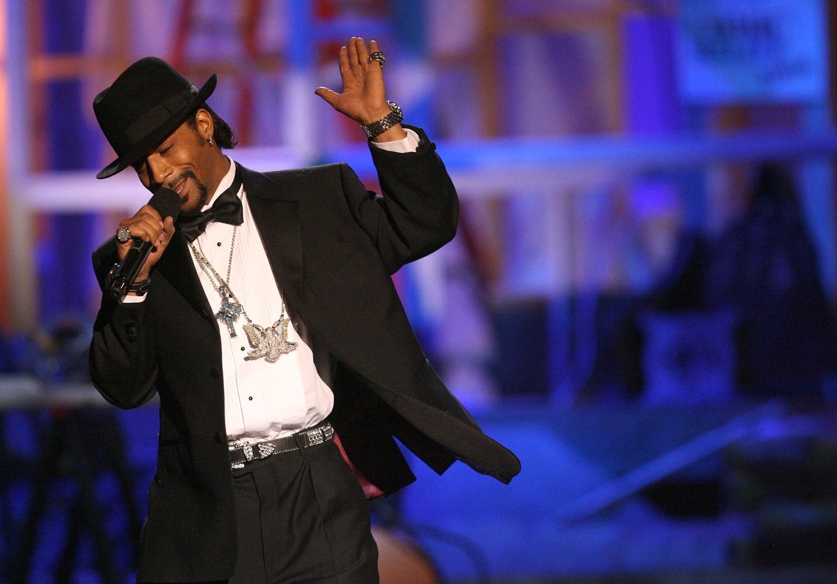 Katt Williams smiling on stage while performing