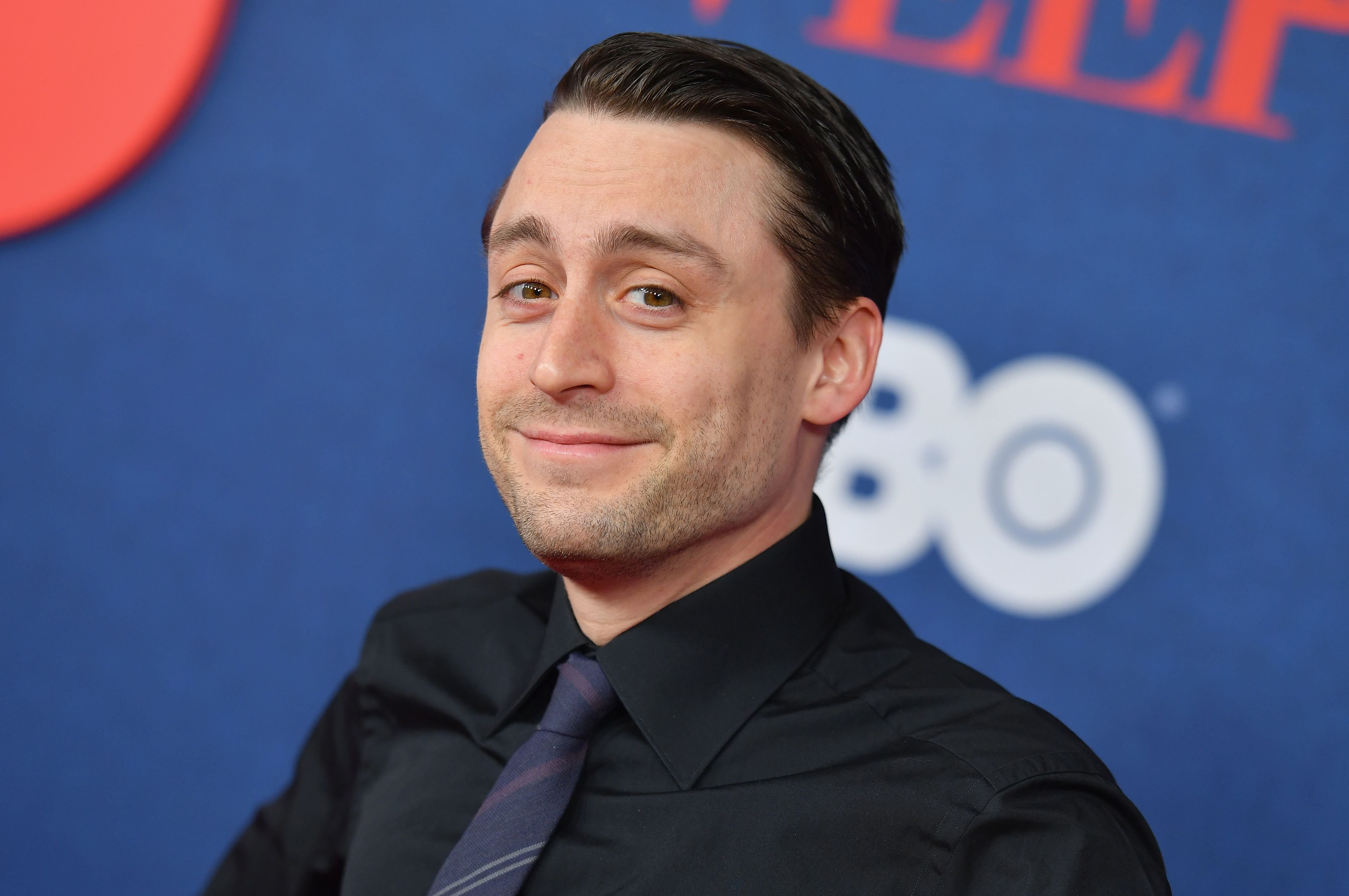 Succession star Kieran Culkin in a black shirt and tie. 