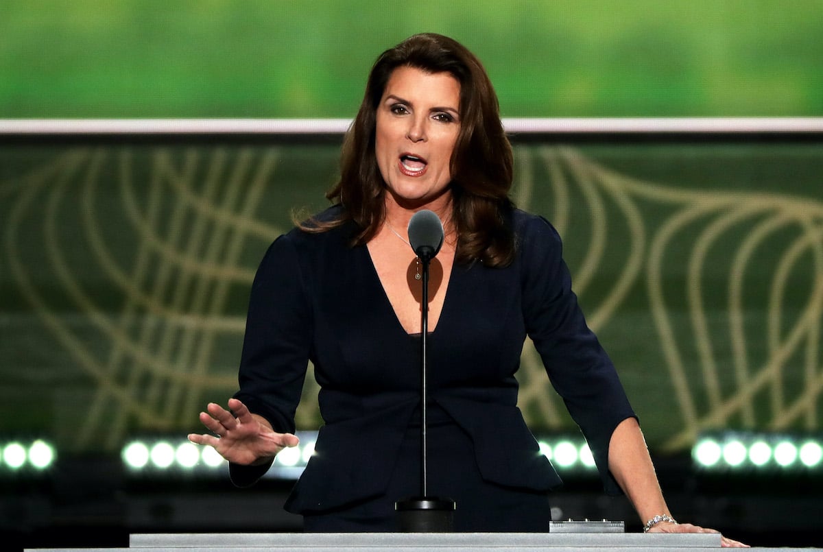 Kimberlin Brown talking in front of a green background