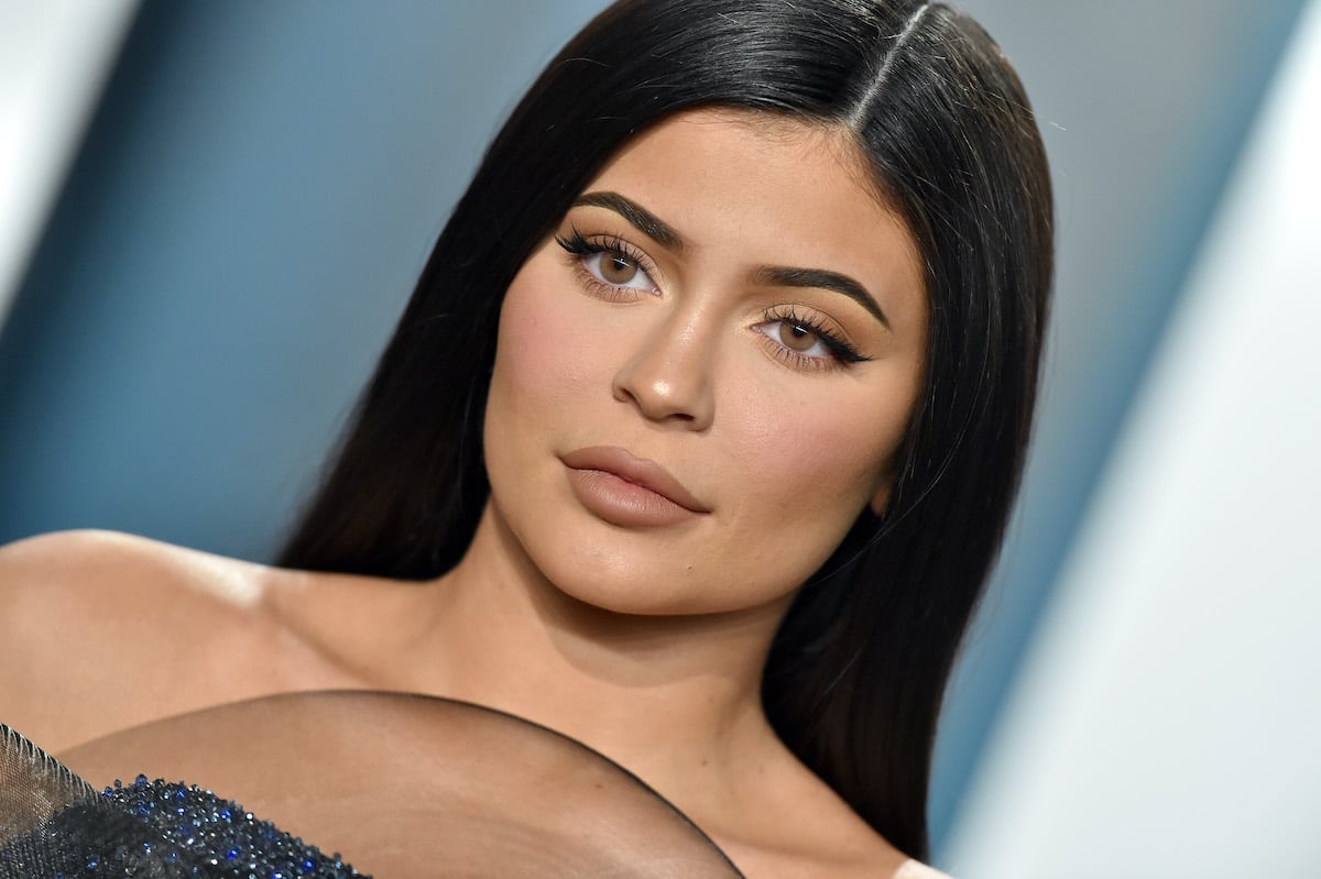 Kylie Jenner in front of a blue and white background