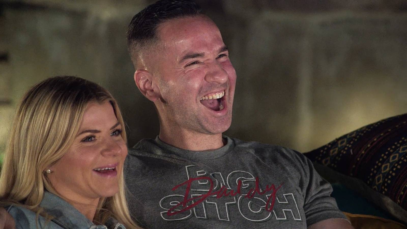 Lauren and Mike 'The Situation' Sorrentino cuddle close together smiling in an episode of 'Jersey Shore: Family Vacation'