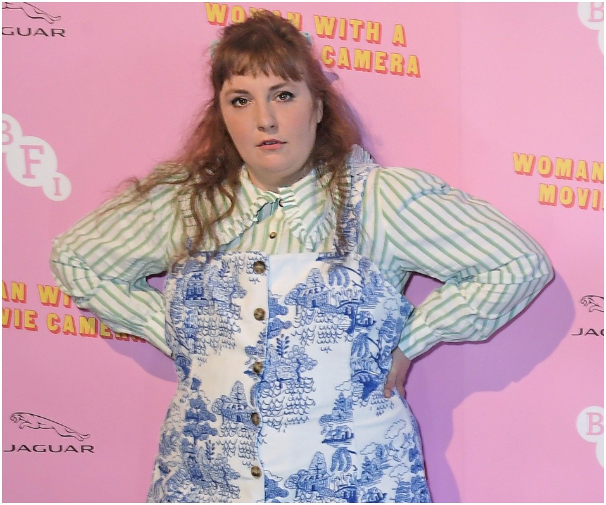 Lena Dunham poses with her hands on her hips at the premiere of 'Rare Beasts'