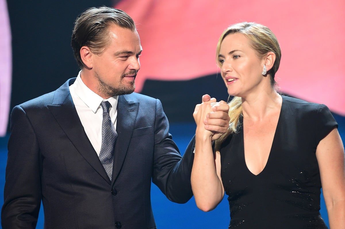 Kate Winslet and Leonardo DiCaprio holding each other's hands