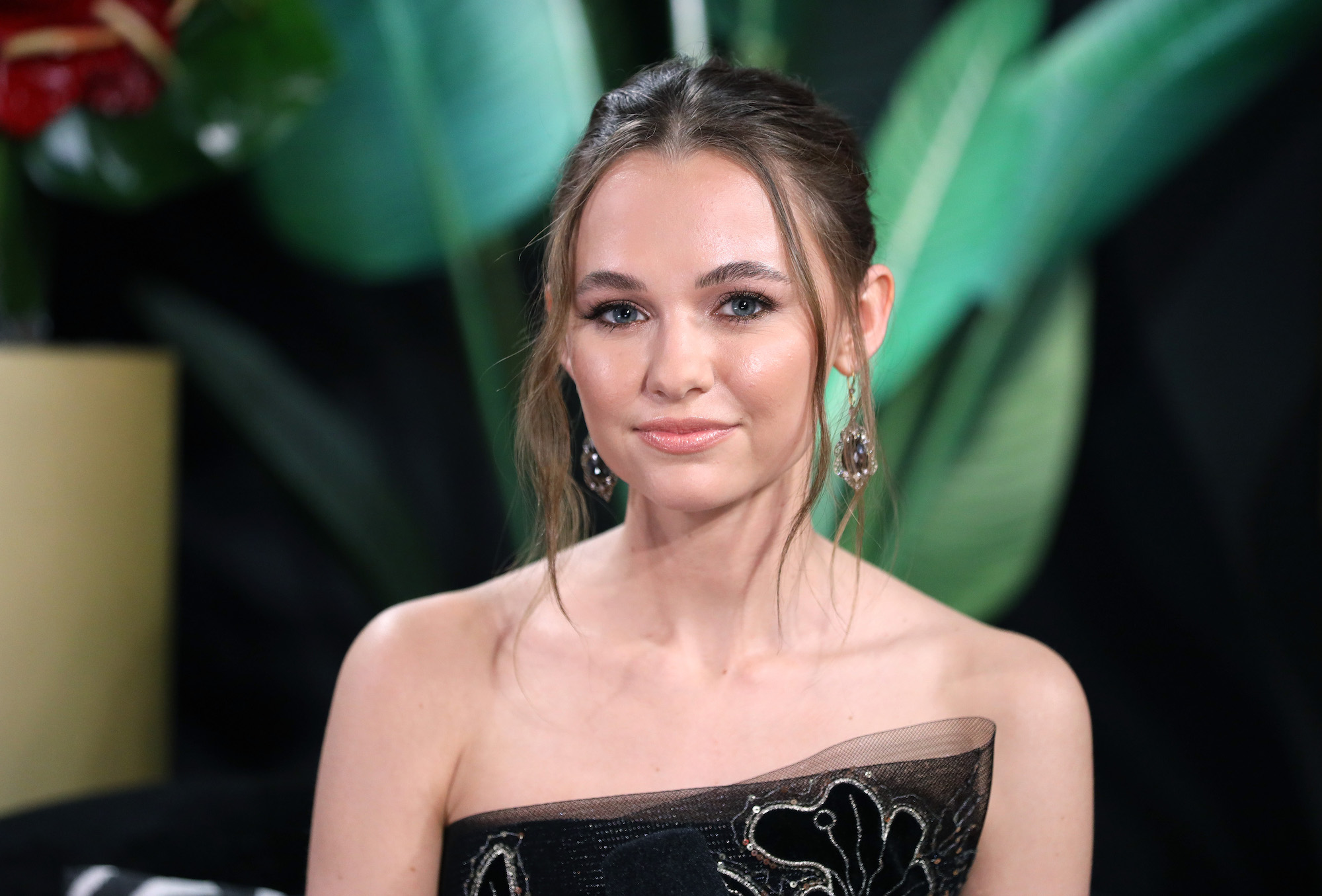 Madison Iseman wearing a black dress to IMDb LIVE Presented By M&M'S At The Elton John AIDS Foundation Academy Awards Viewing Party.