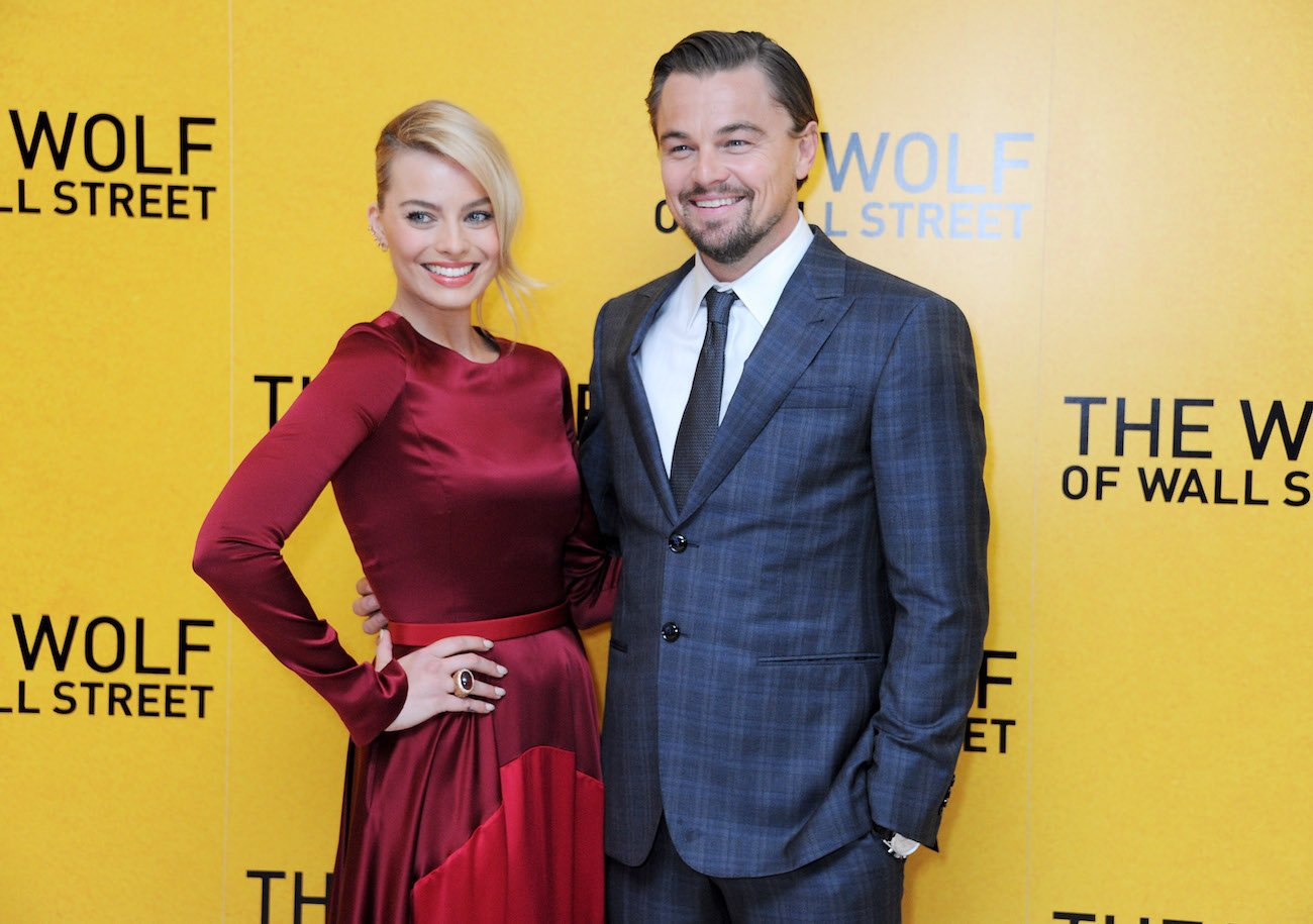 Margot Robbie and Leonardo DiCaprio smile as they stand together at the U.K. premiere of 'The Wolf of Wall Street'