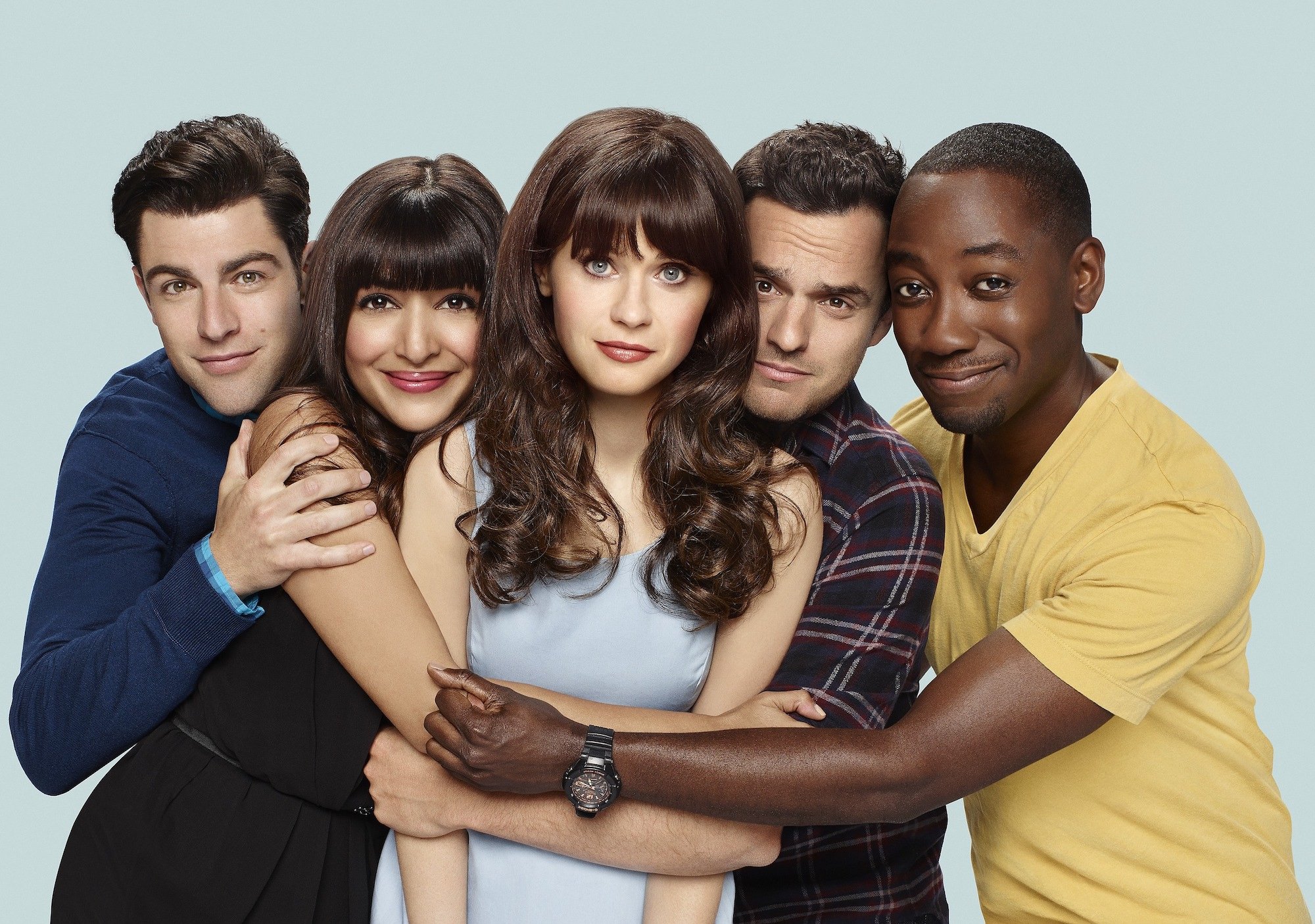 Max Greenfield, Hannah Simone, Zooey Deschanel, Jake Johnson and Lamorne Morris hugging each other on a promotional image for 'New Girl' Season 6.