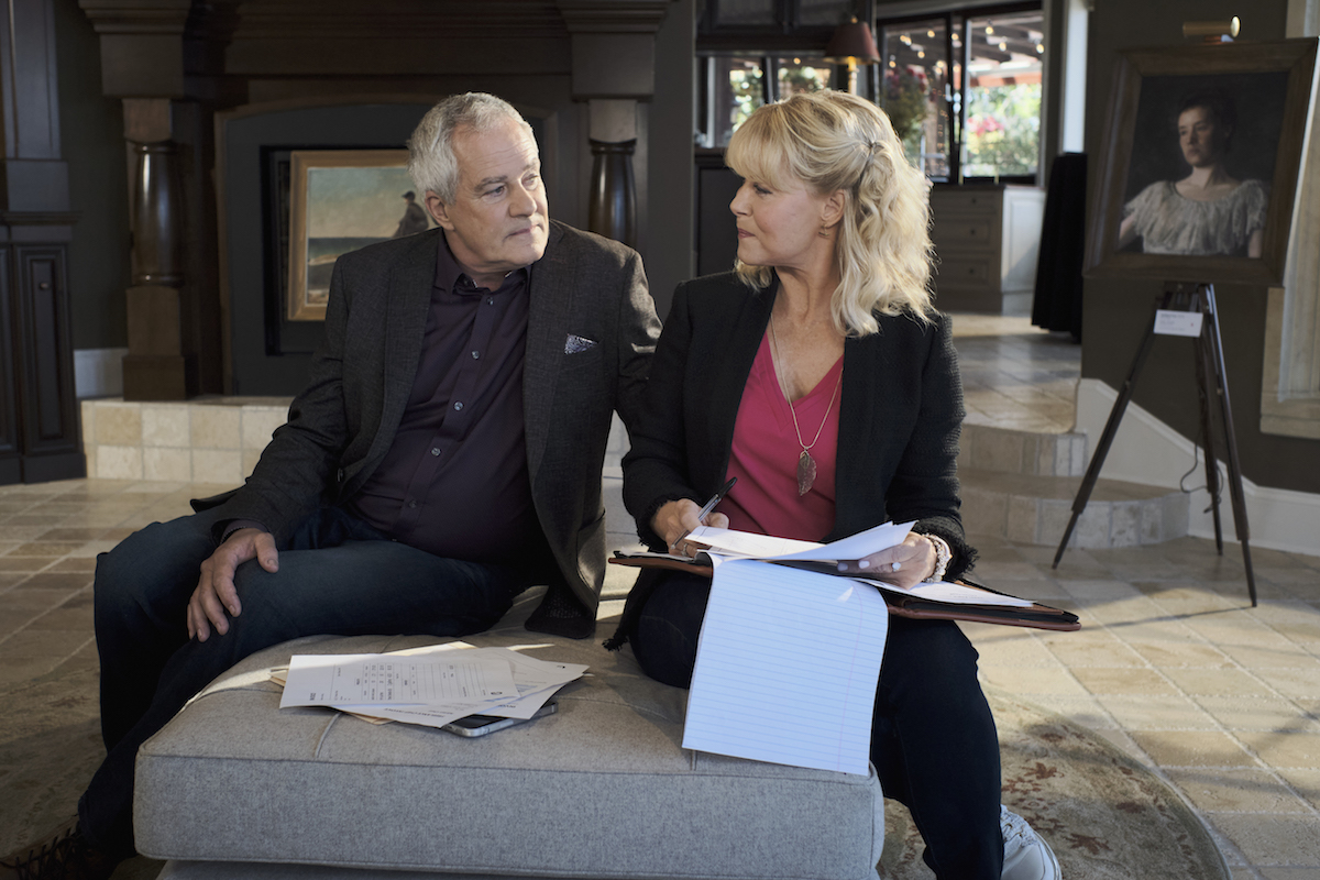 Megan holding papers and talking to a white-haired man in the 'Chesapeake Shores' Season 5 finale