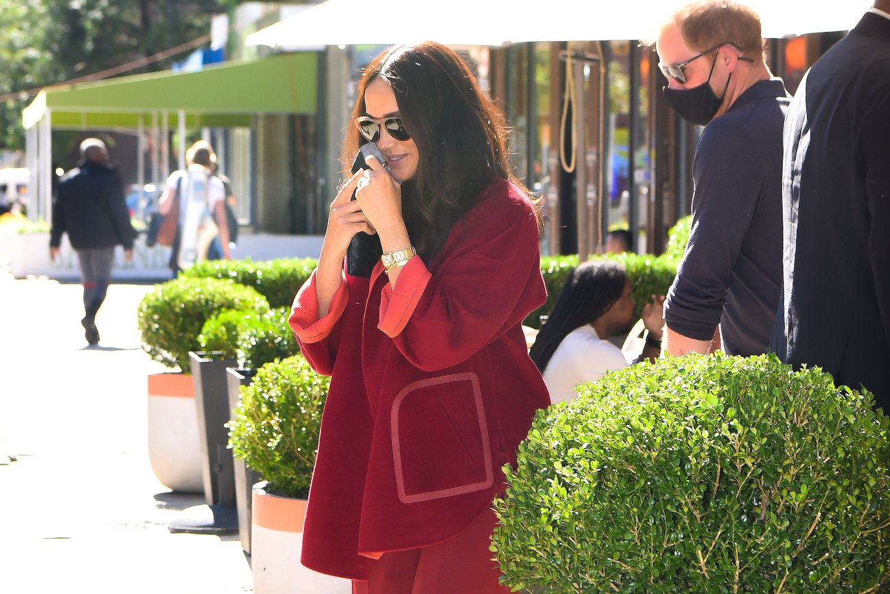 Meghan Markle wearing a red cashmere sweater in New York City