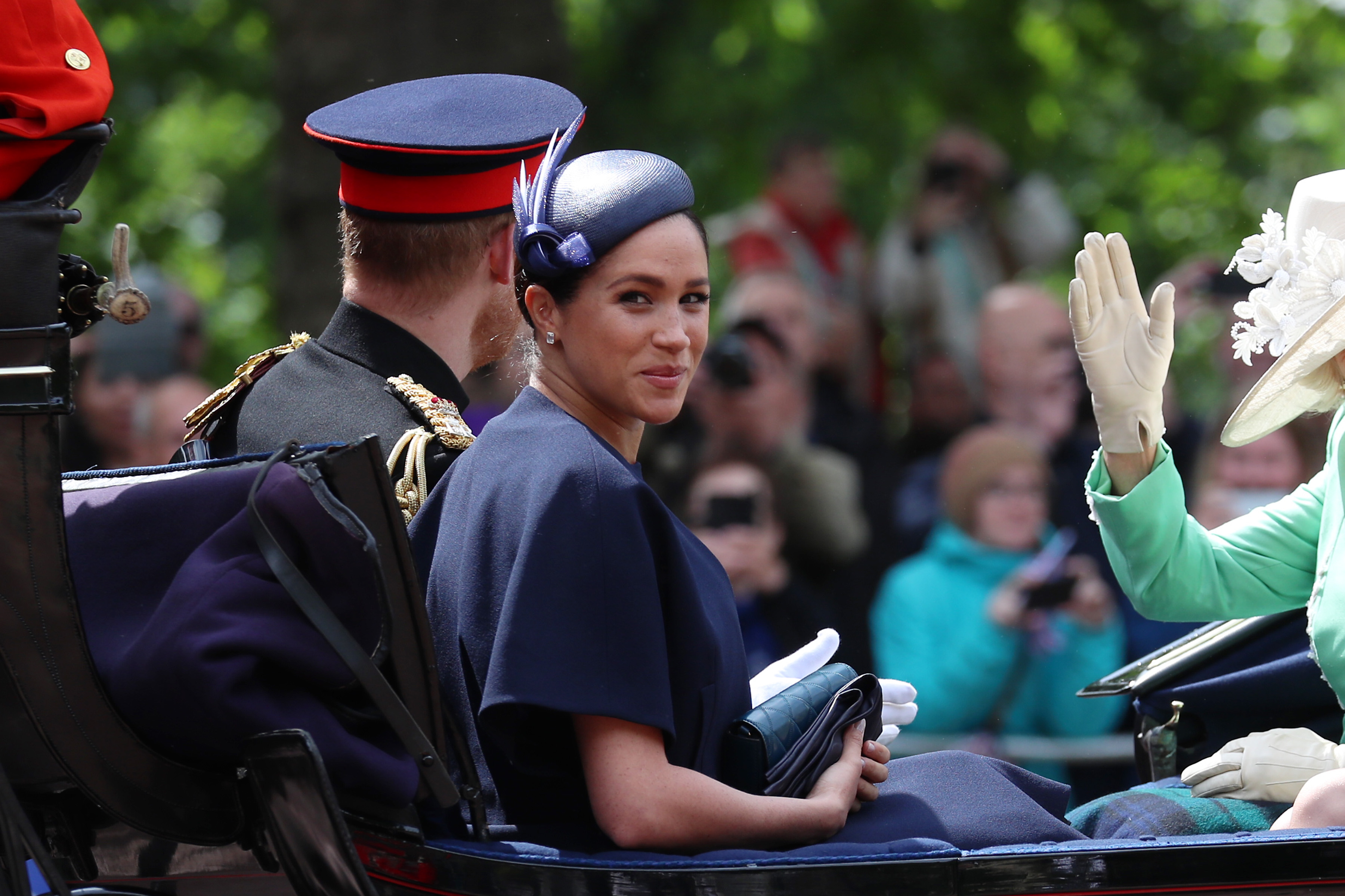 Meghan Markle smiling in carriage during Trooping The Colour 2019