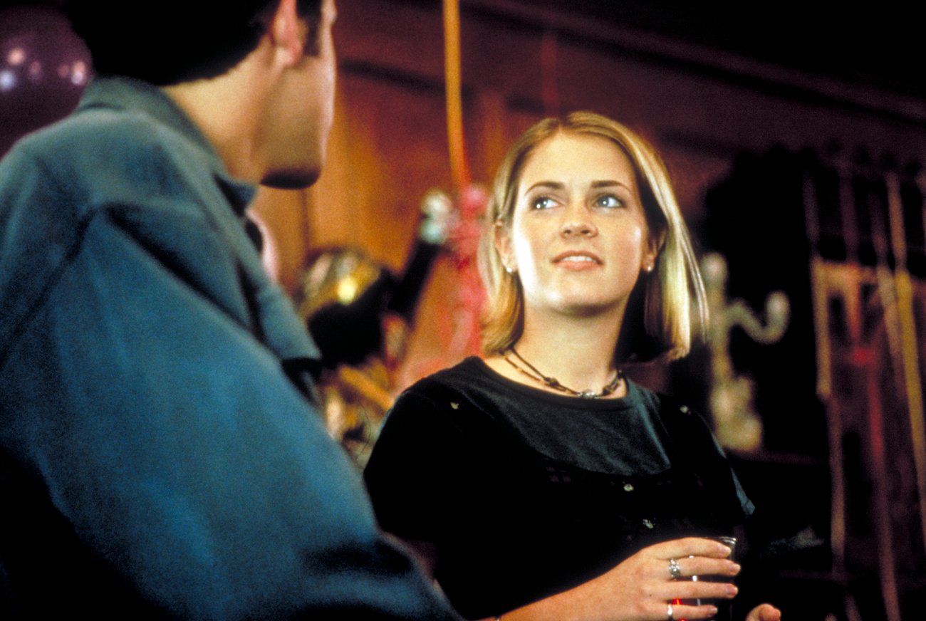 Melissa Joan Hart wears a black shirt in a scene from the 'Sabrina the Teenage Witch' movie