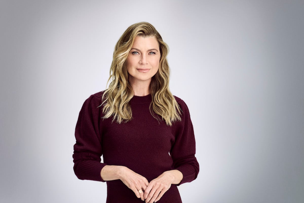 Ellen Pompeo as Meredith Grey smiling in front of a gray background
