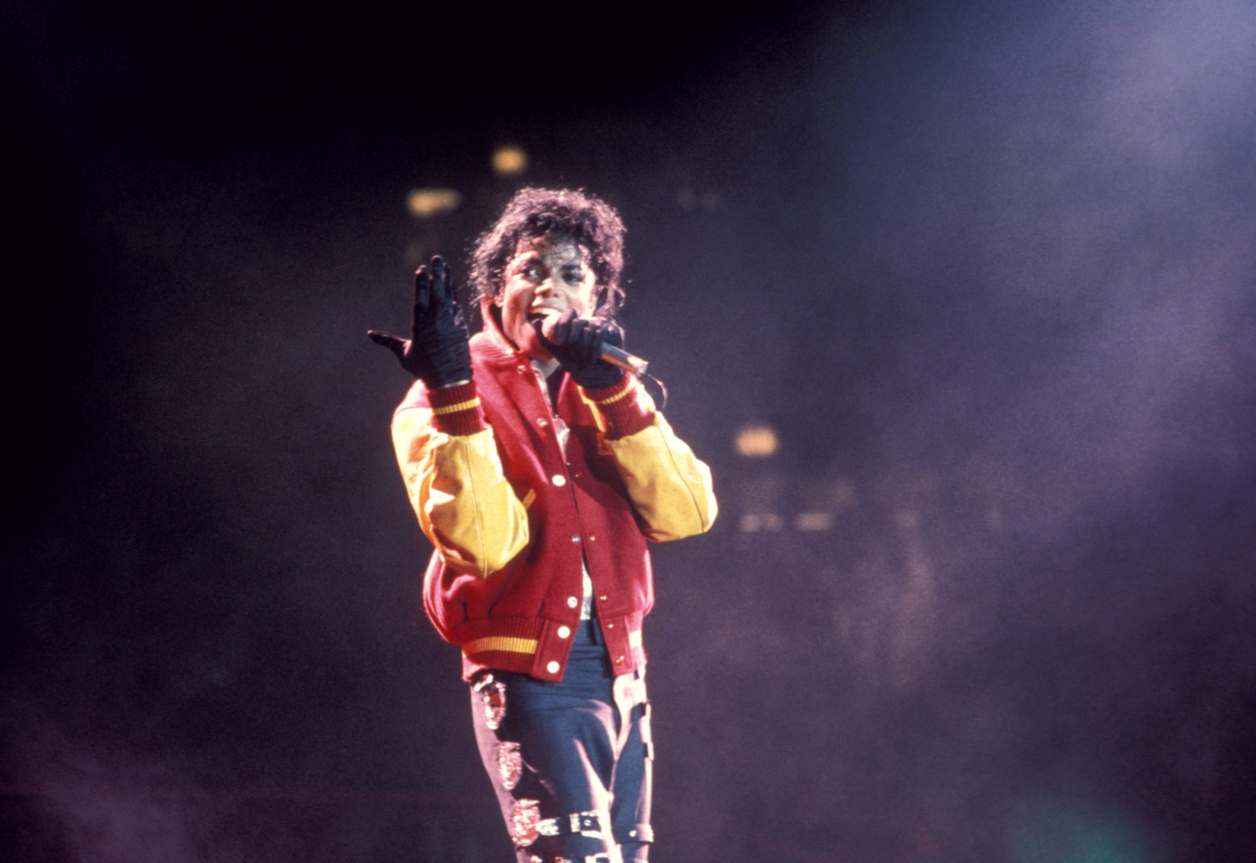 Michael Jackson performing on stage, performing 'Thriller - Bad Tour'