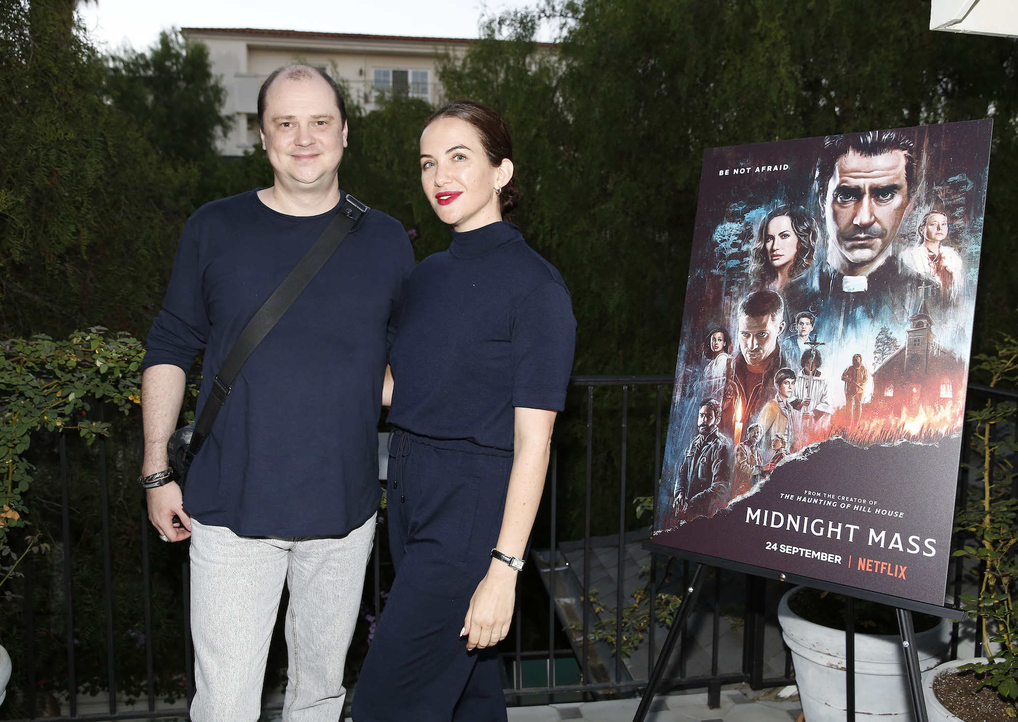 Mike Flanagan with his arm around Kate Siegel at a Midnight Mass screening