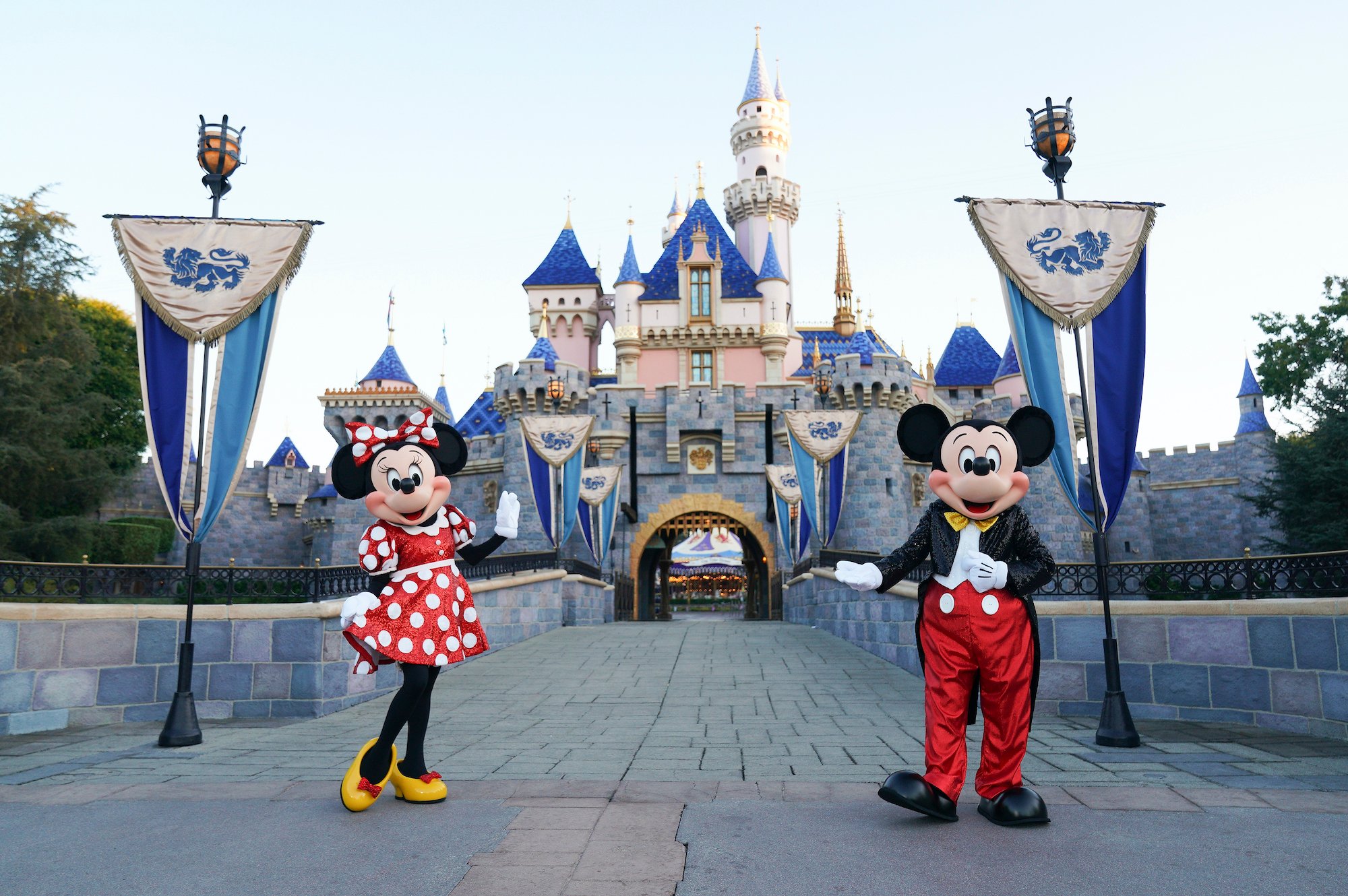 Minnie Mouse and Mickey Mouse pose in front of the castle in Disneyland for 'DWTS' Disney Night
