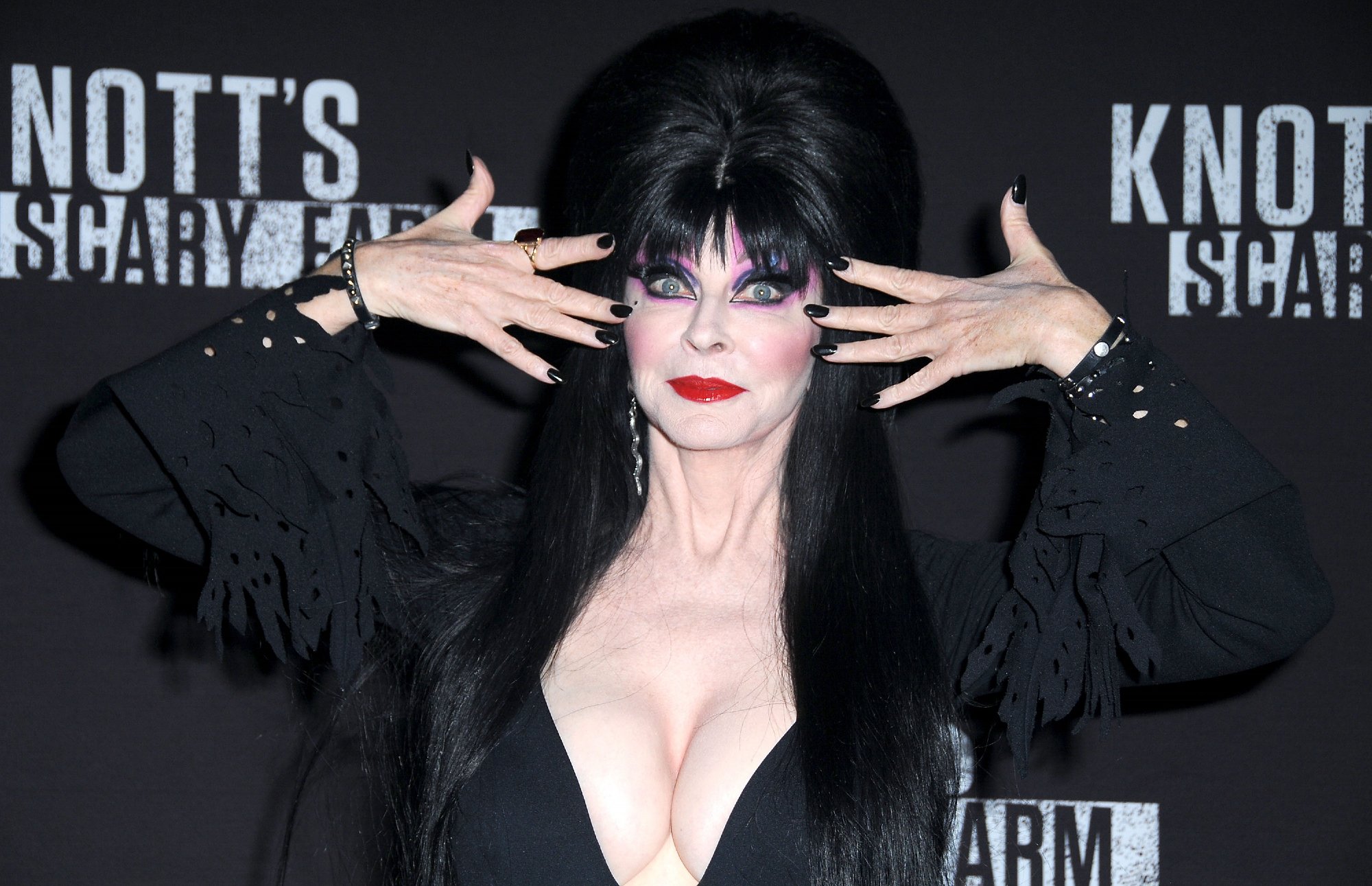 Netflix host Elvira posing wearing black at Knott's Scary Farm and Instagram Celebrity Night at Knott's Berry Farm 