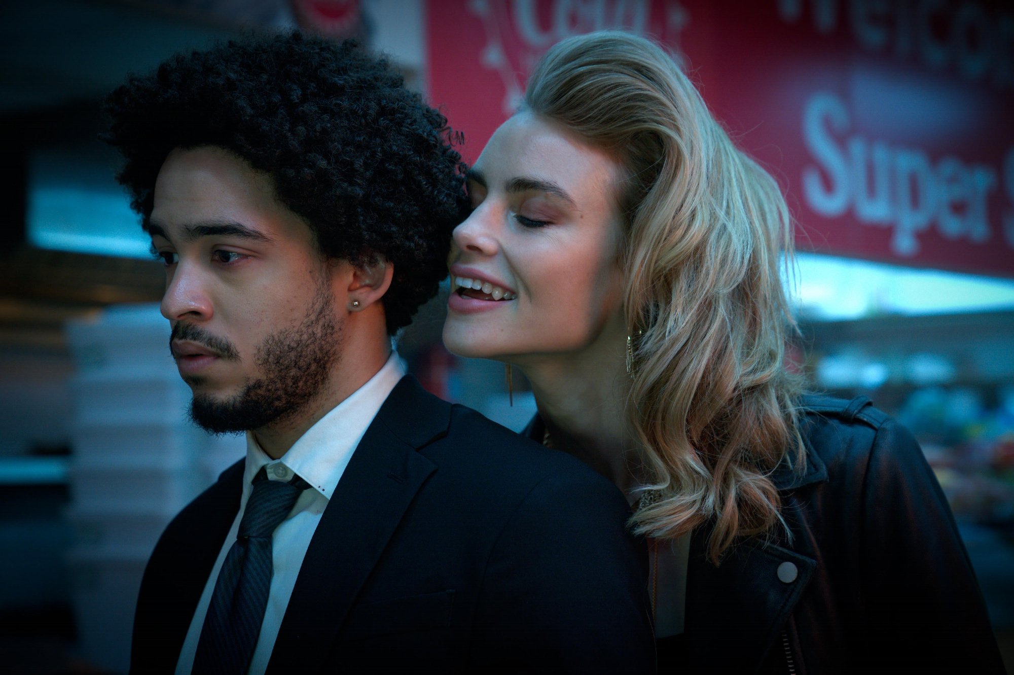 'Night Teeth' stars Jorge Lengeborg Jr. as Benny and Lucy Fry as Zoe with Zoe leaning over Benny's shoulder