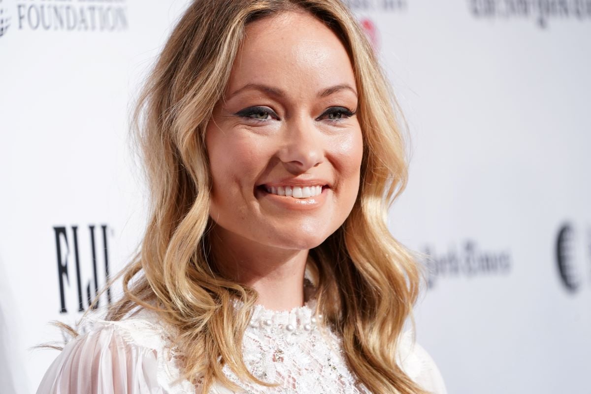 Olivia Wilde smiling in white