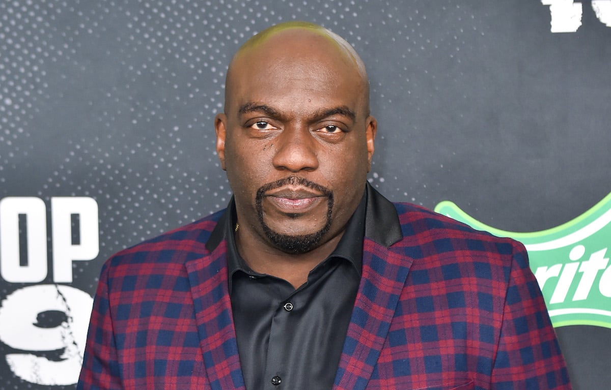 Omar Dorsey wears a patterned suit on the red carpet of an award show