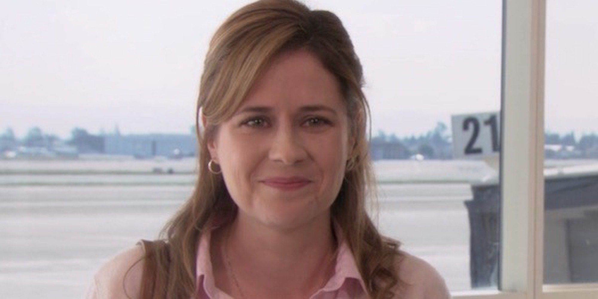 Jenna Fischer as Pam Halpert looking into the camera at the airport in 'The Office' episode 'Goodbye Michael'