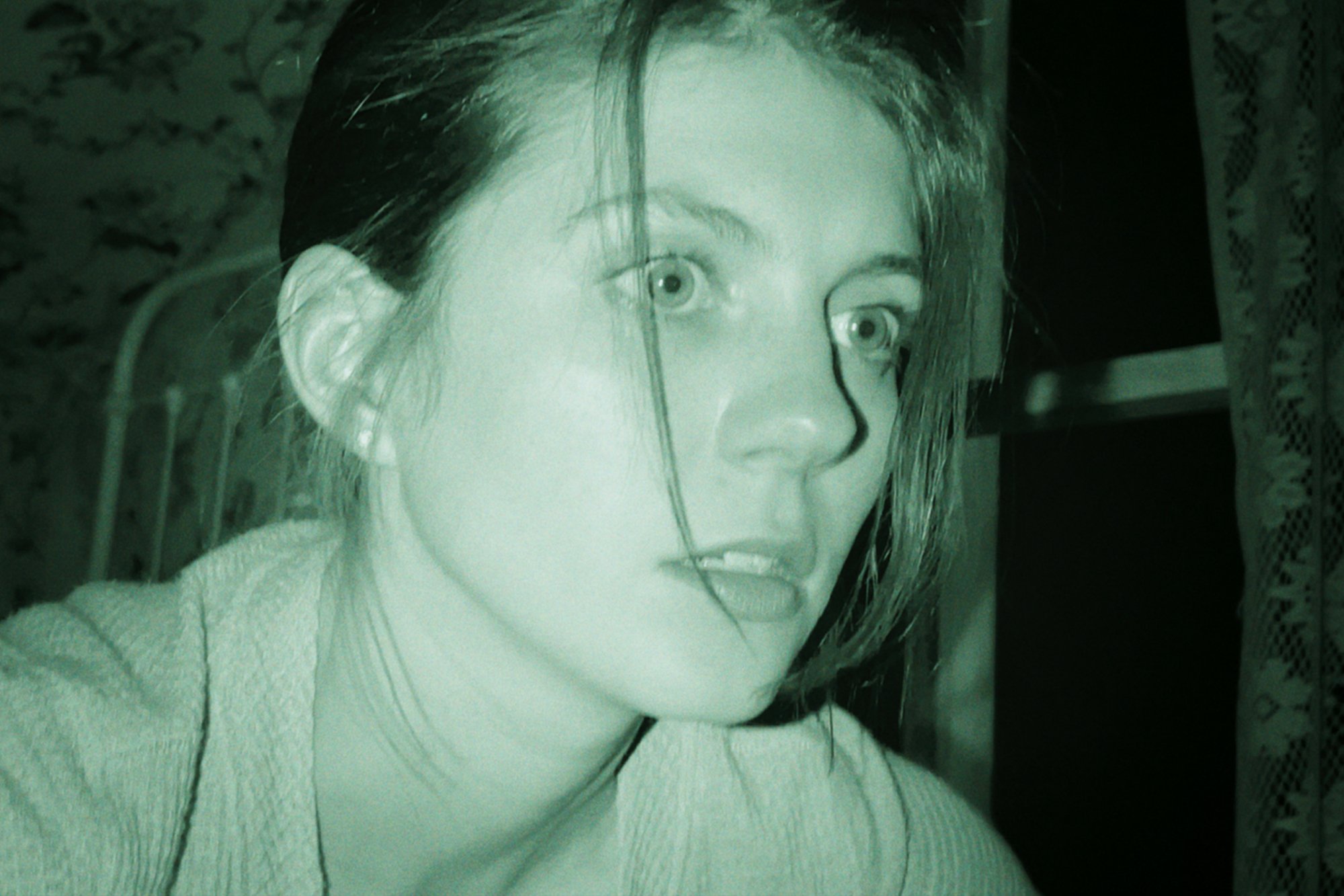'Paranormal Activity: Next of Kin' star Emily Bader as Margot looking terrified in night vision