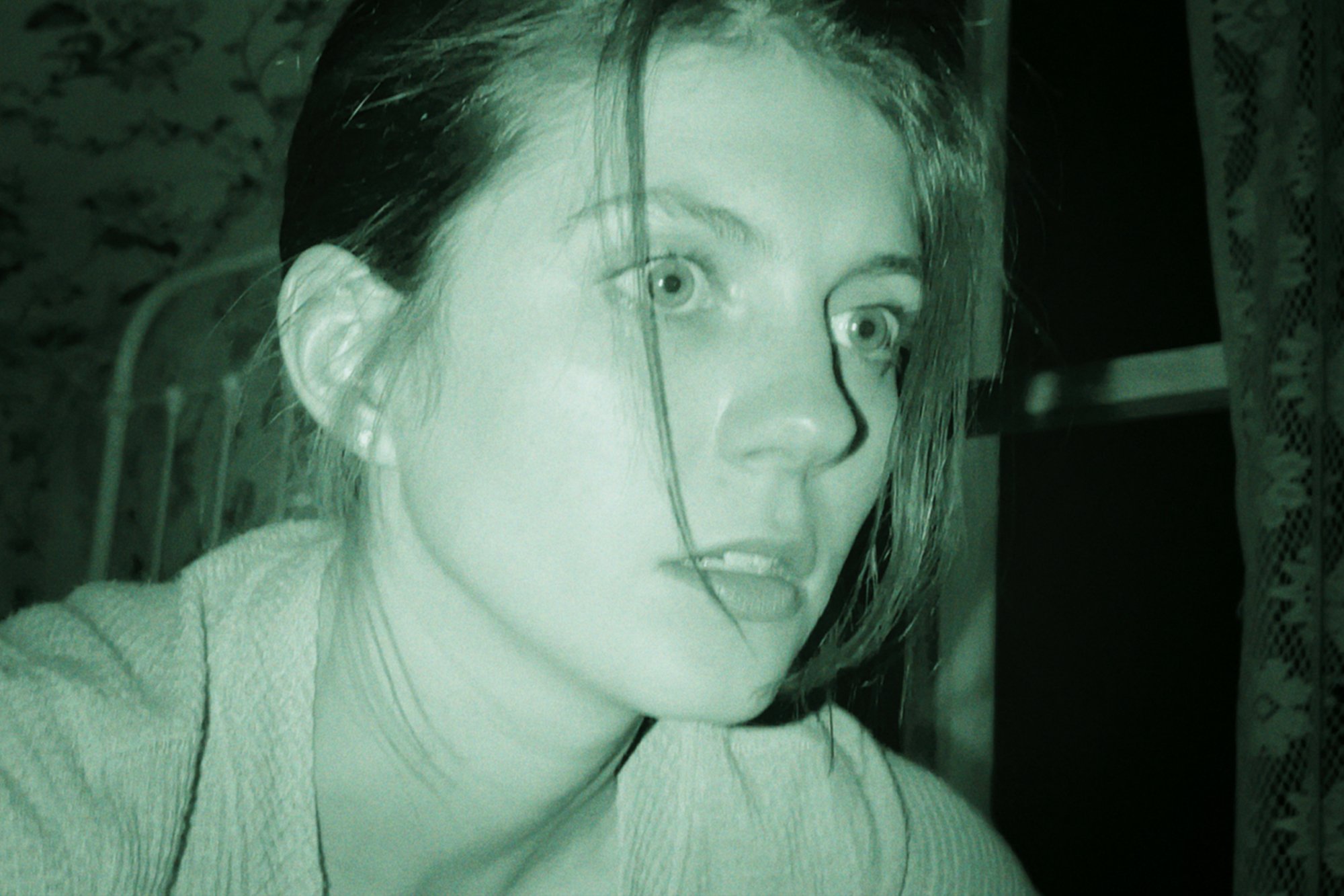 'Paranormal Activity: Next of Kin' star Emily Bader as Margot looking terrified in night vision