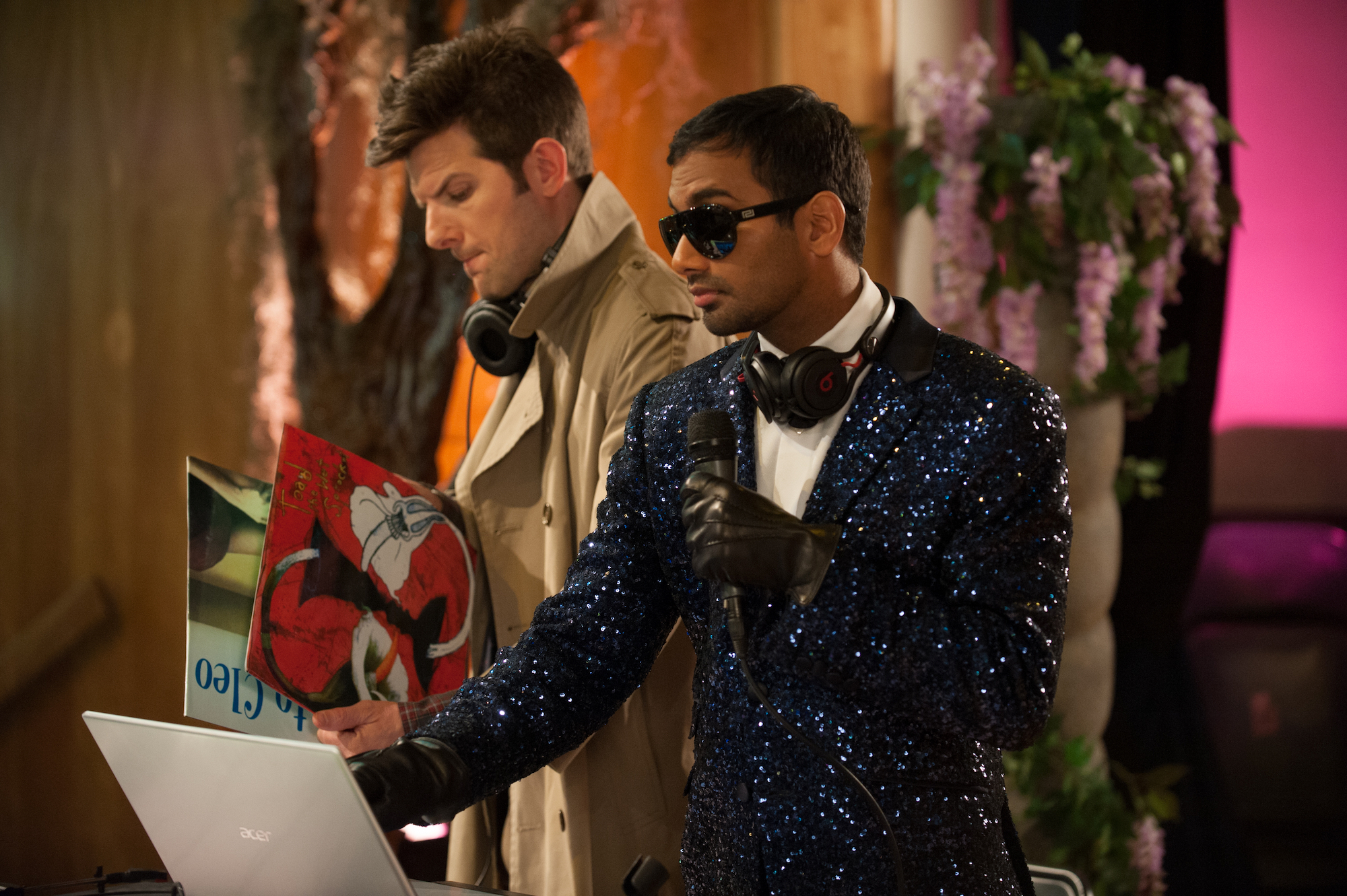 Parks and Recreation: Aziz Ansari DJs while Adam Scott looks at records