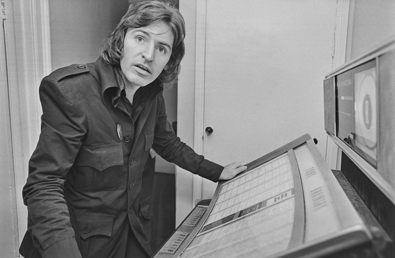 Paul McCartney's brother, Michael McGear at a jukebox in 1974.