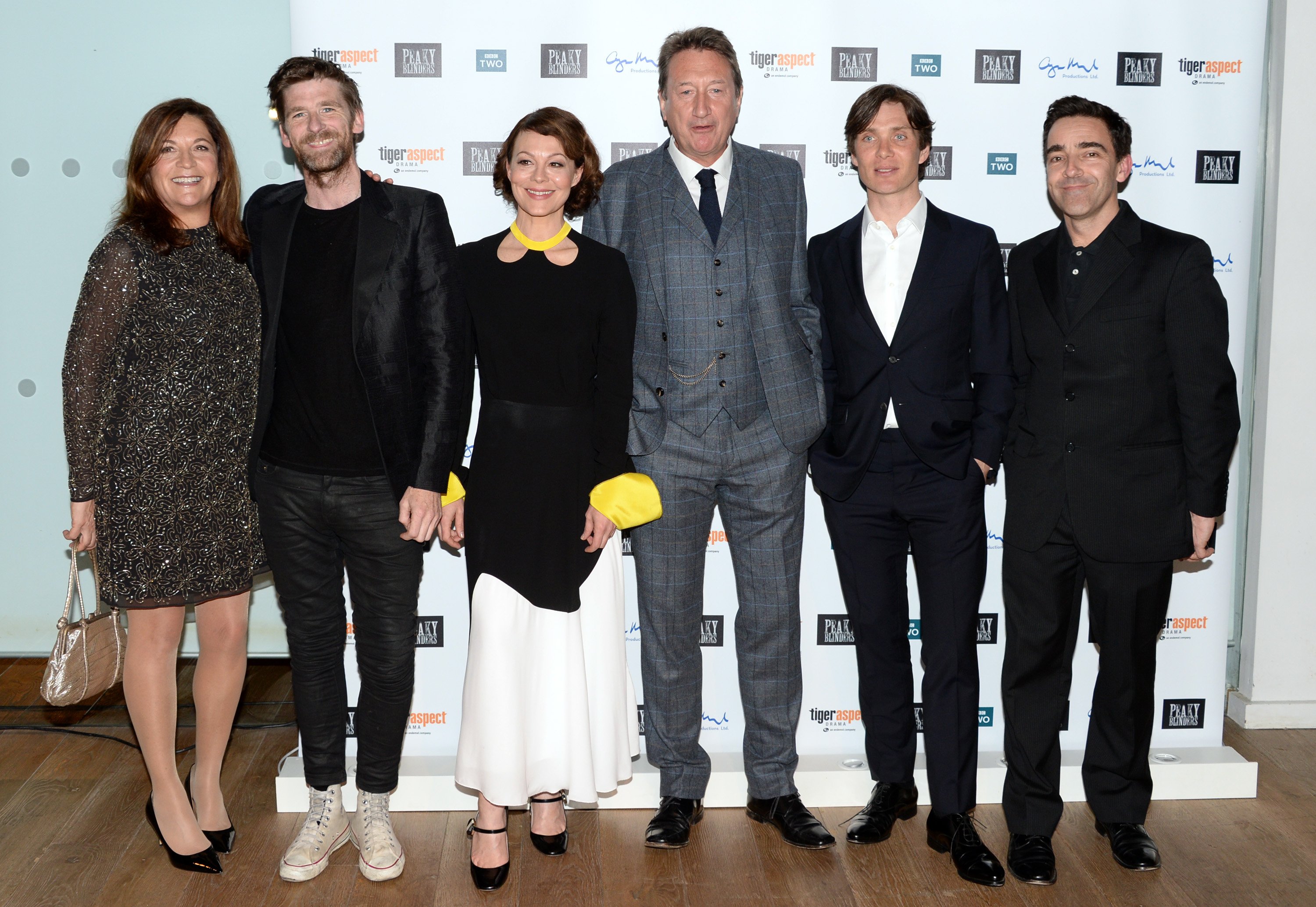 Peaky Blinders has an interesting meaning behind its name.Caryn Mandabach, Paul Anderson, Helen McCrory, Steven Knight and Cillian Murphy smile for a photo.