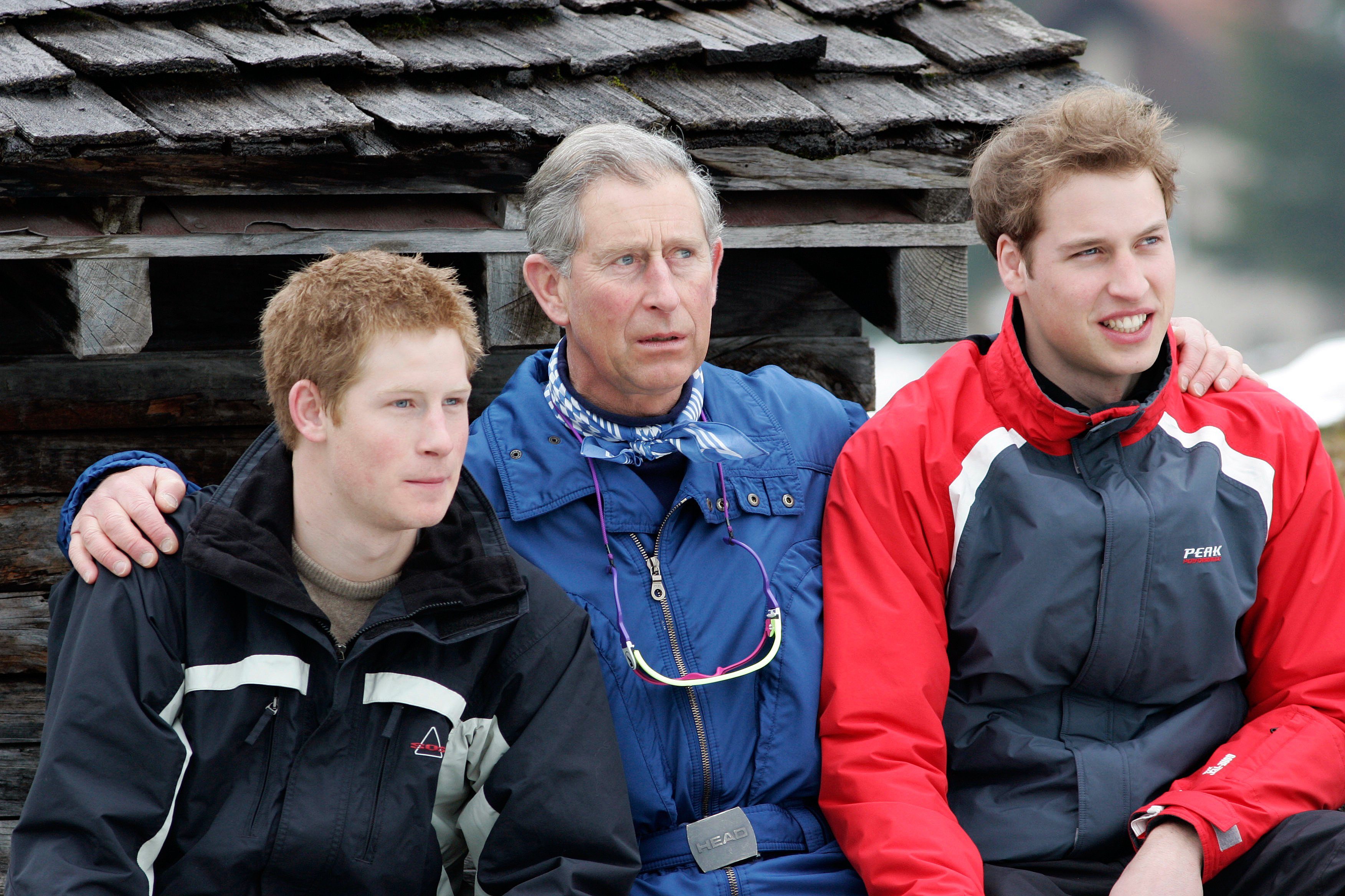 Prince Charles was overheard muttering criticism for the press during a photocall with Prince William and Prince Harry 