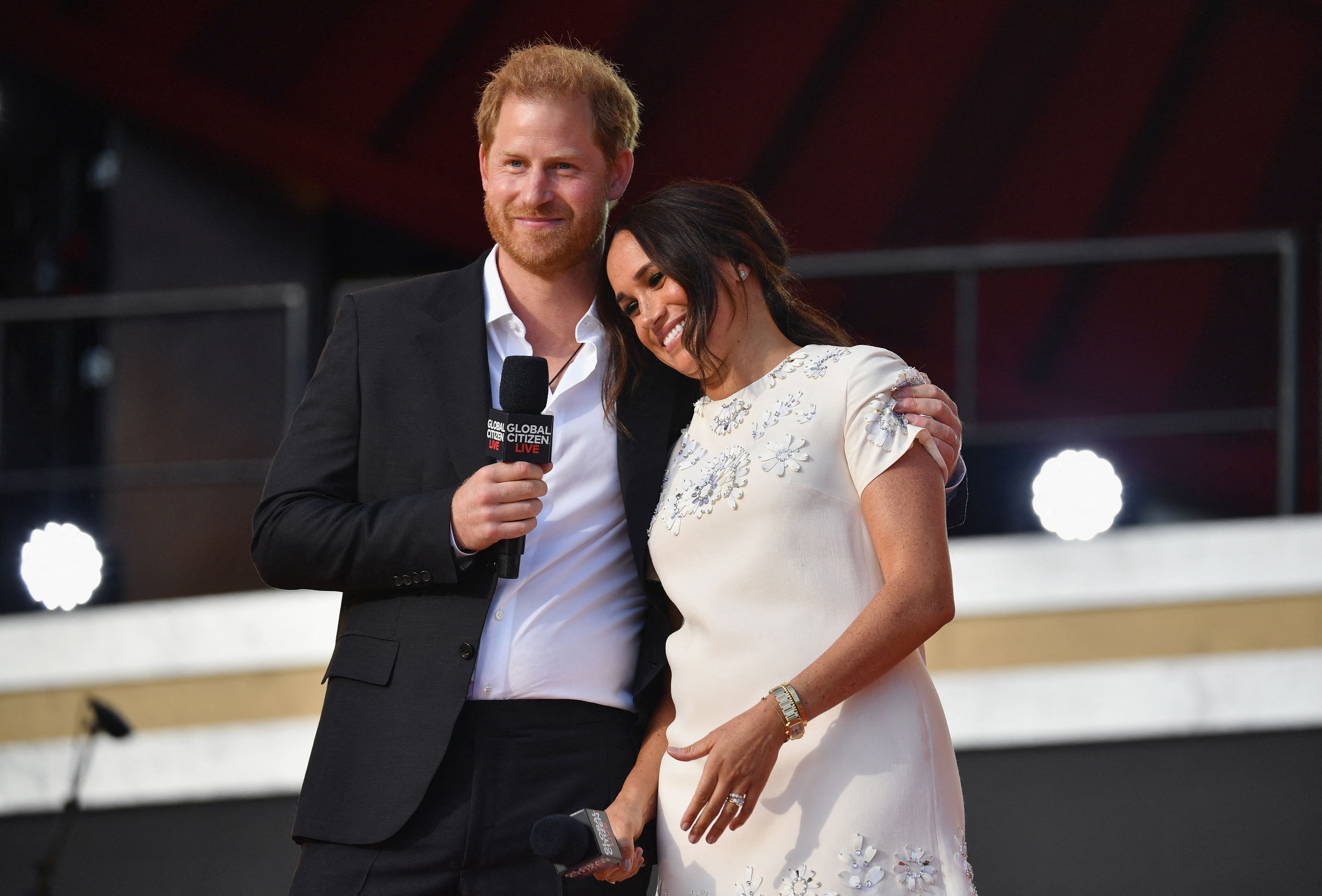 Prince Harry and Meghan Markle laughing and sharing a sweet moment onstage during the 2021 Global Citizen Live event