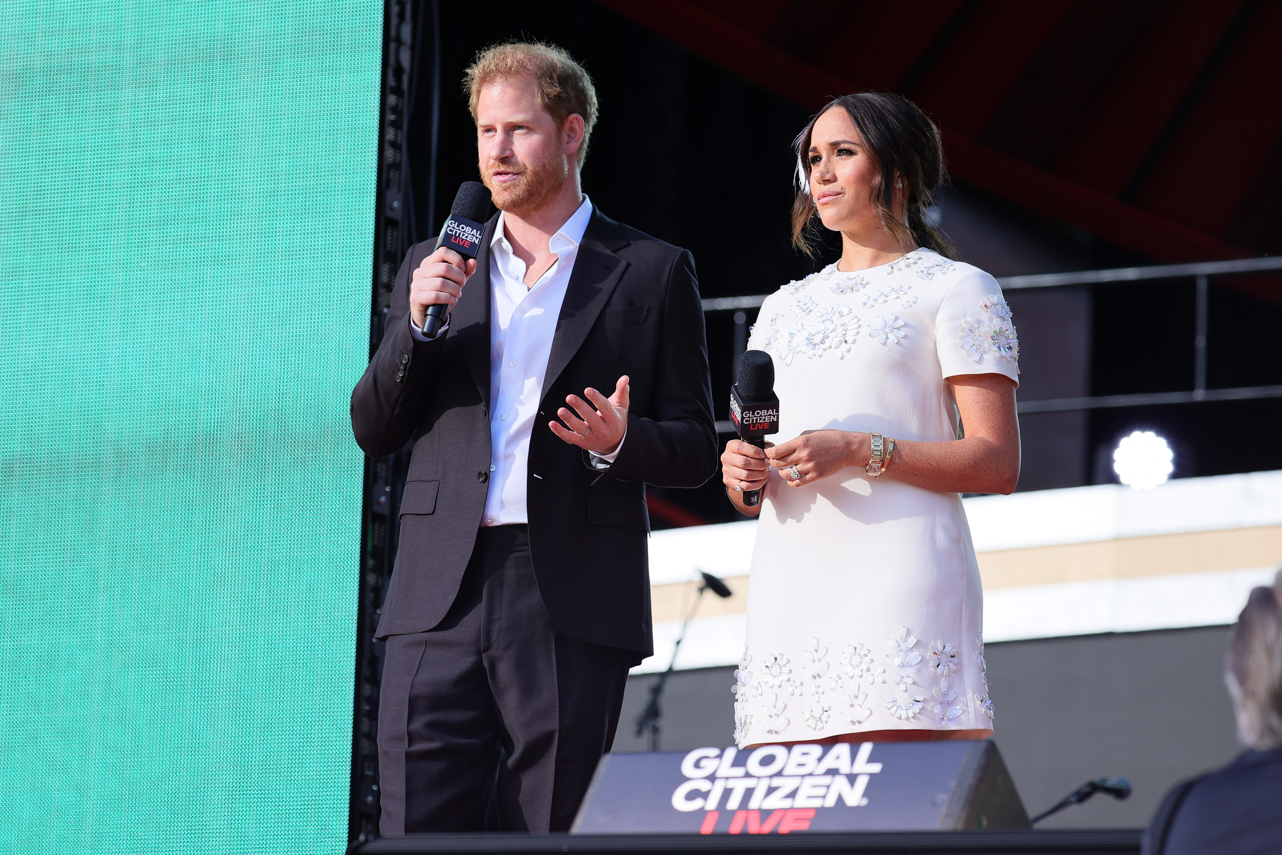 Prince Harry and Meghan Markle speak onstage during Global Citizen Live