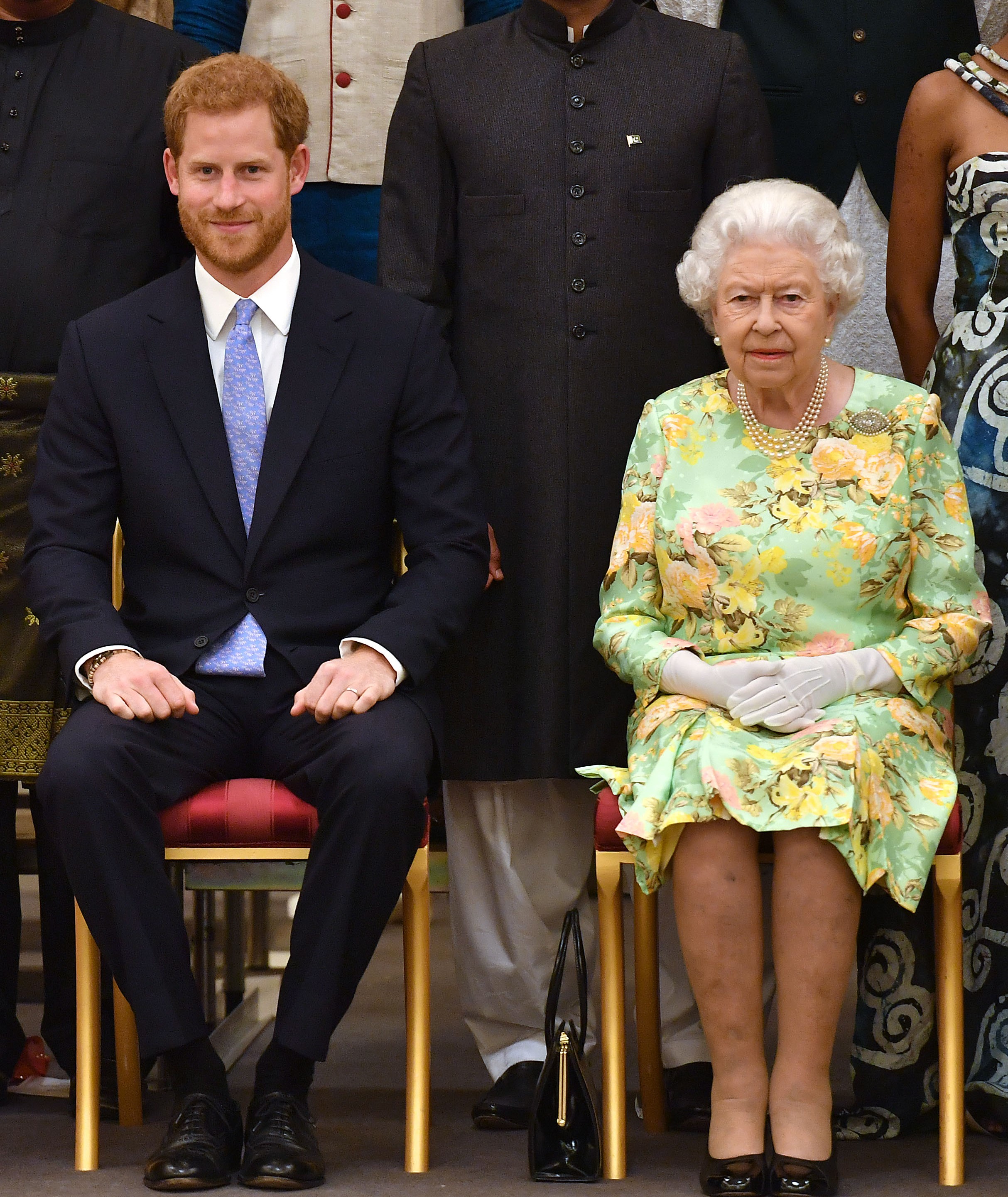 Prince Harry and Queen Elizabeth II pose for a picture during the Queen's Young Leaders Awards Ceremony