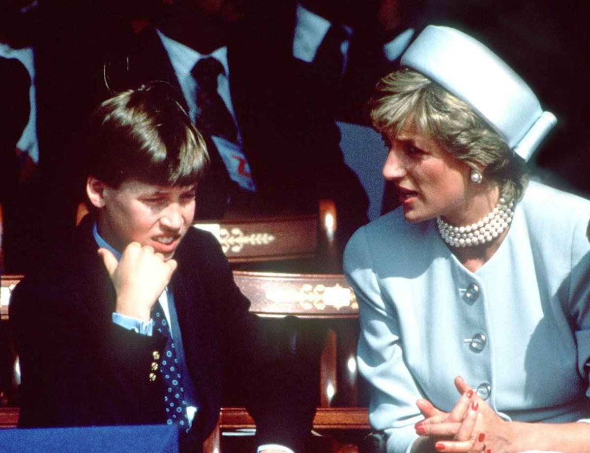 Prince William sitting next to his mother, Princess Diana, at an event in London in 1995
