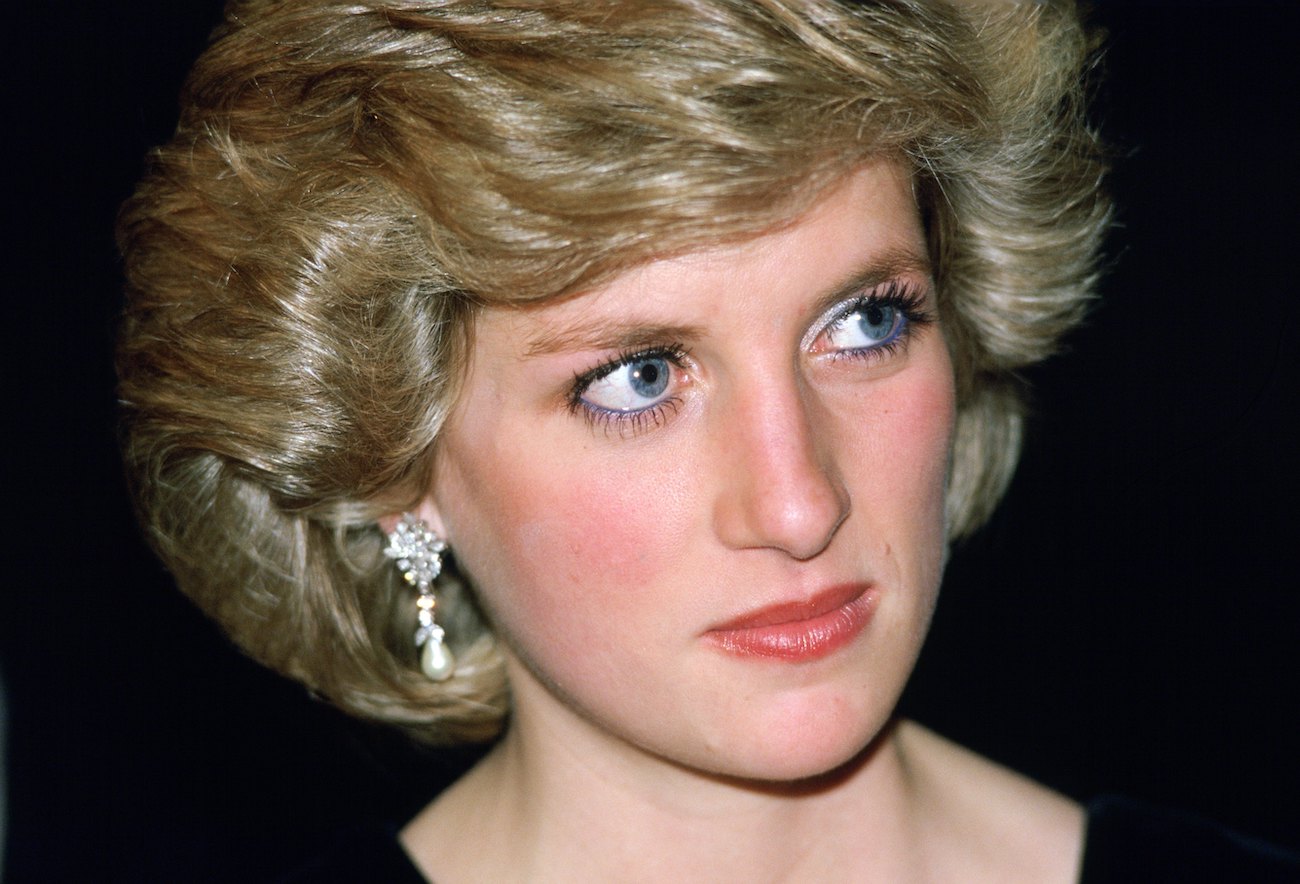 Princess Diana looking on, close up