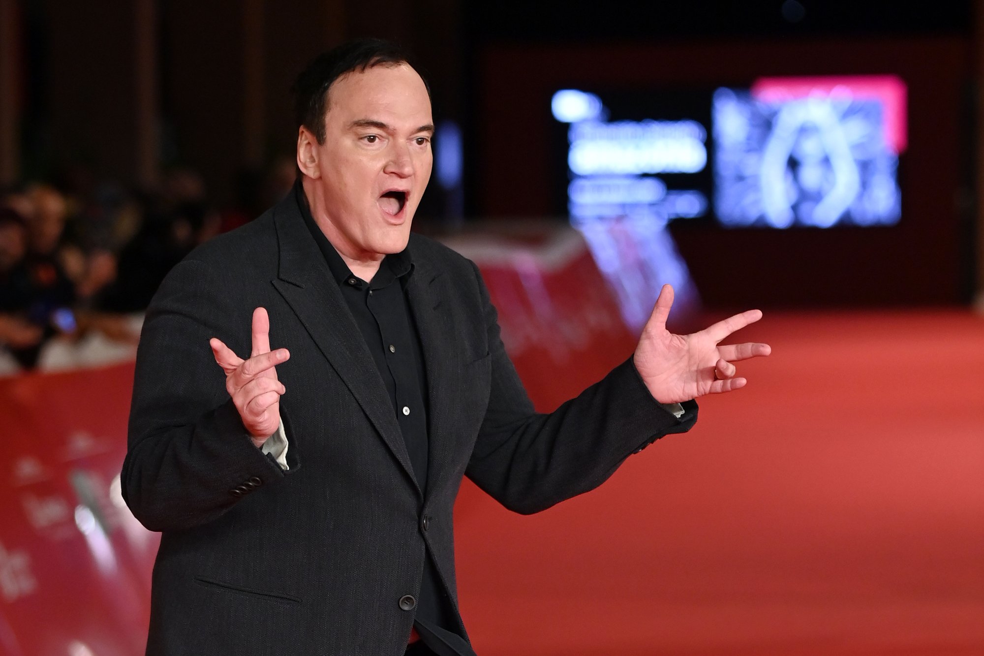 Quentin Tarantino at the Rome Film Festival looking surprised