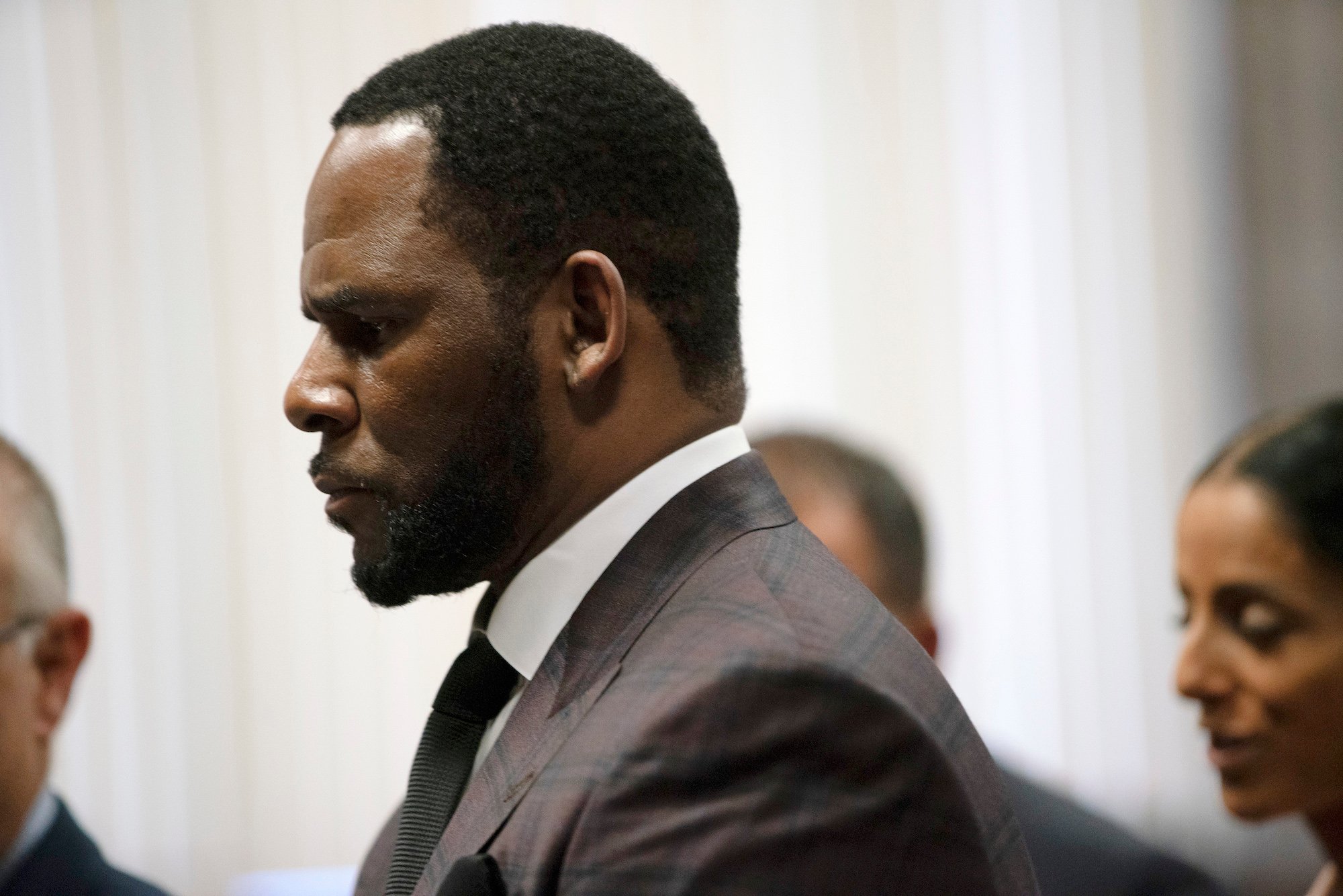 R. Kelly stands in court