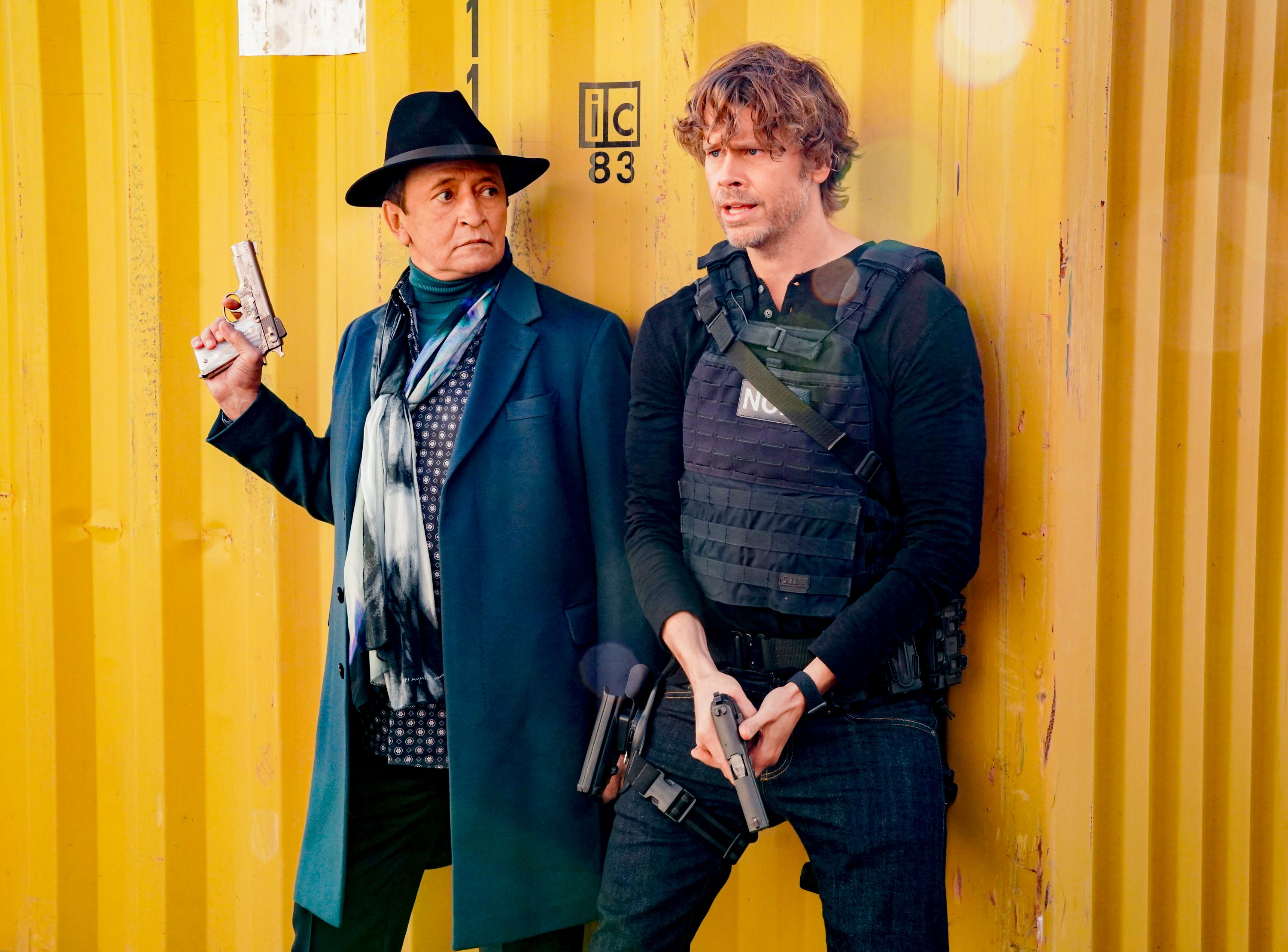 Ravil Isyanov and Eric Christian Olsen hold guns on NCIS: Los Angeles