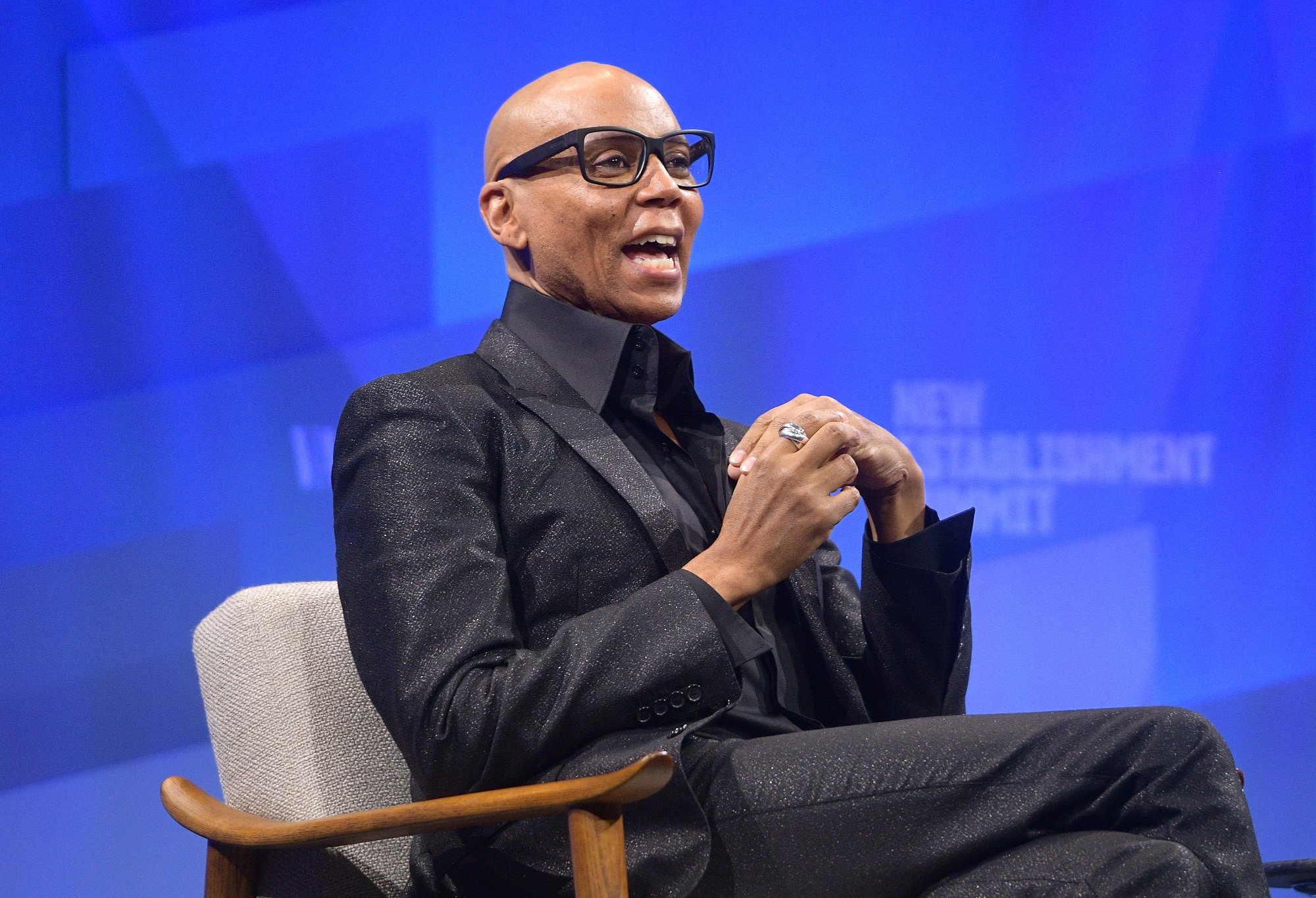 'RuPaul's Drag Race' host RuPaul at Vanity Fair's 6th Annual New Establishment Summit wearing a black suit