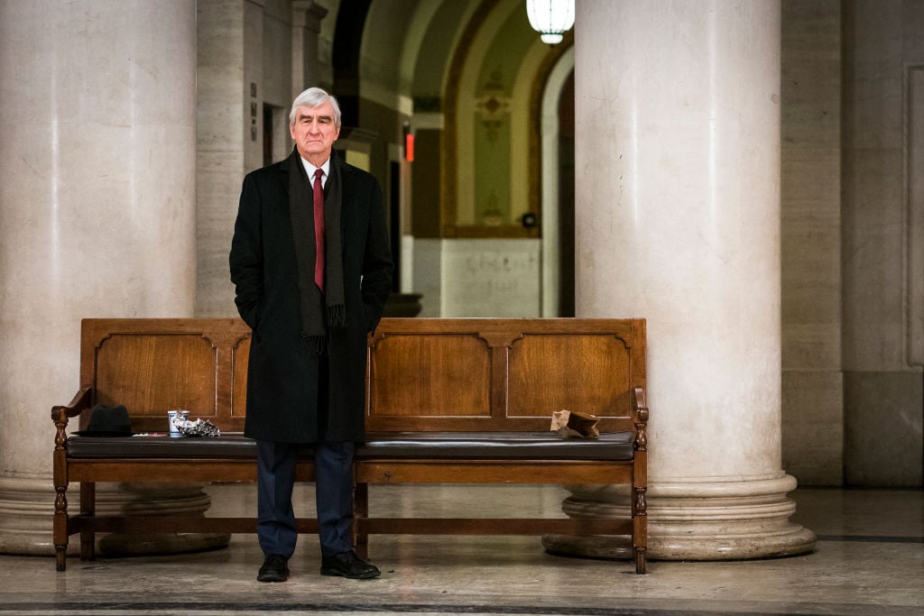 Sam Waterston as DA Jack McCoy standing in a courthouse.
