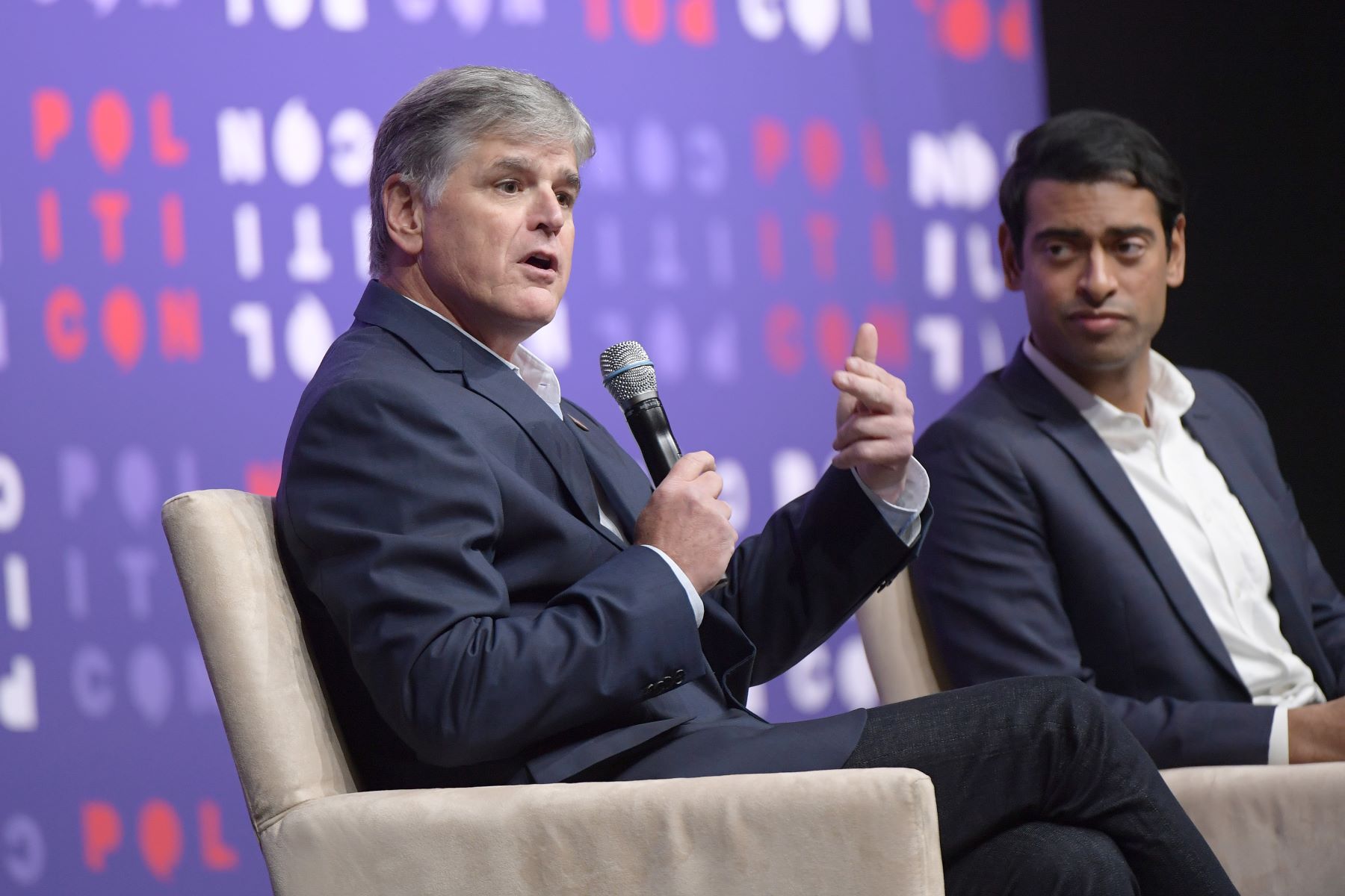 Sean Hannity with Steven Olikara on stage at the 2019 Politicon at the Music City Center in Nashville, Tennessee