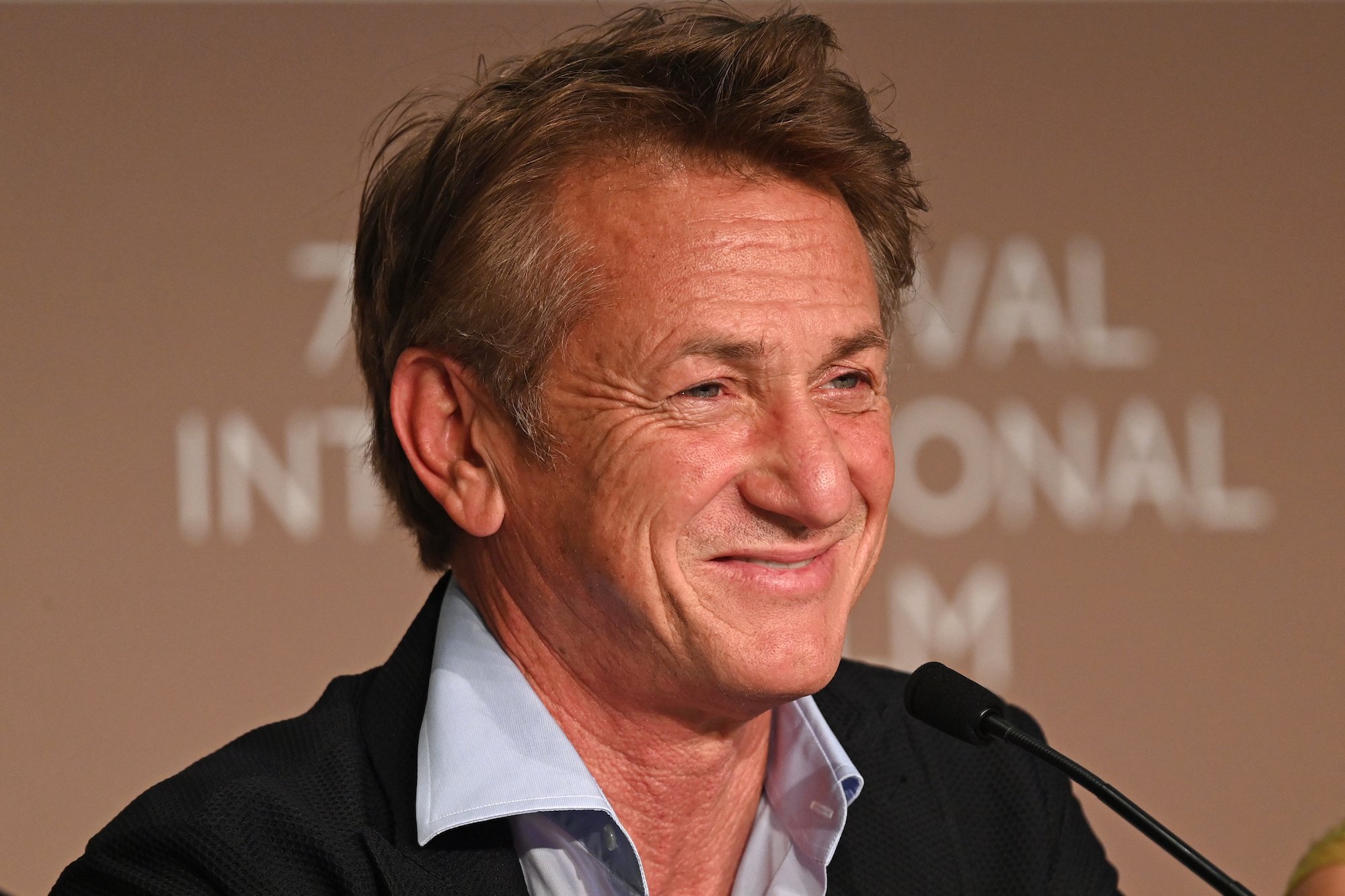Sean Penn smiles at the Flag Day press conference