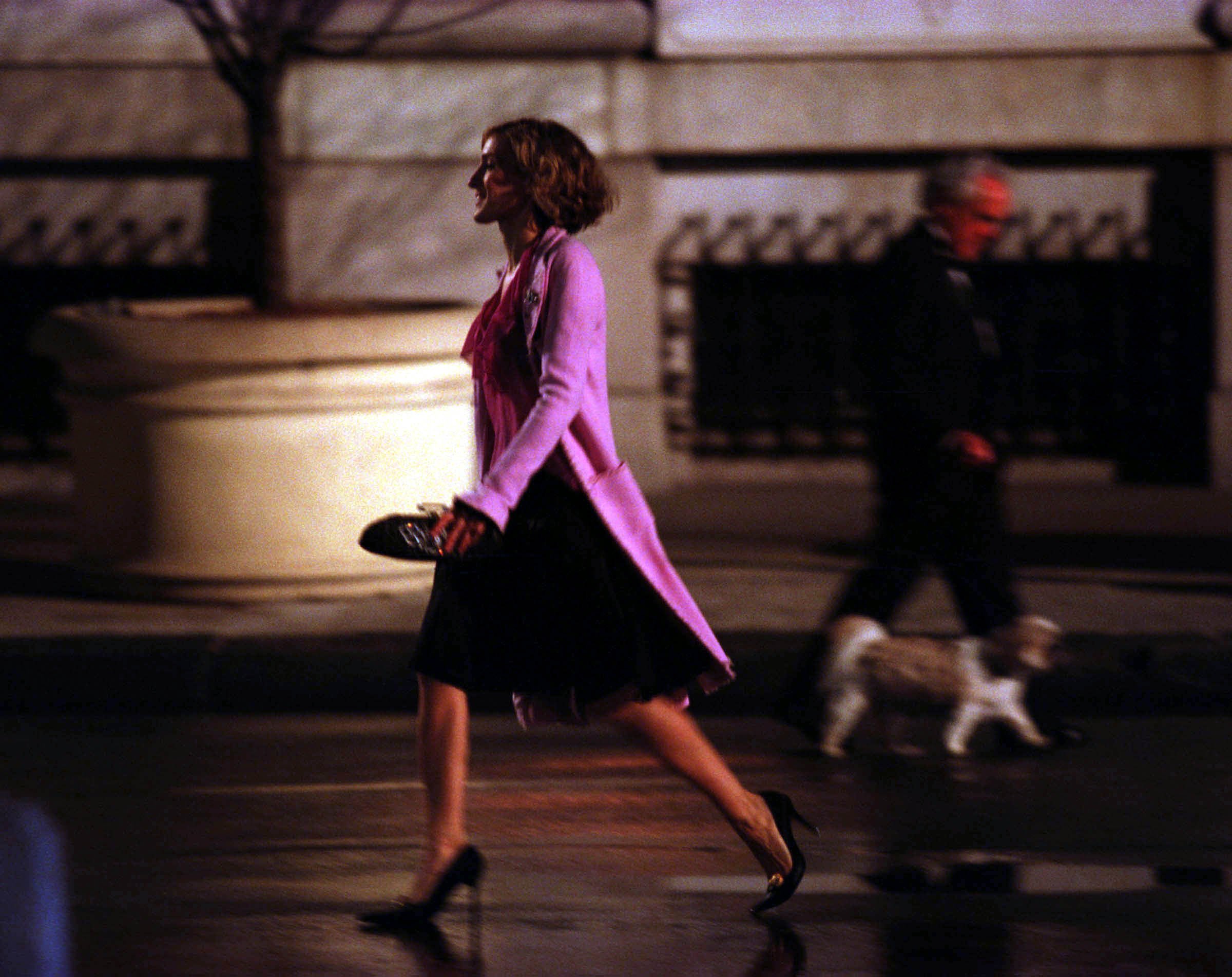 Sarah Jessica Parker hurries down the street while on the set of 'Sex and the City' in 2002. Carrie Bradshaw's hair is the shorrtest it has ever been in the series during season 5