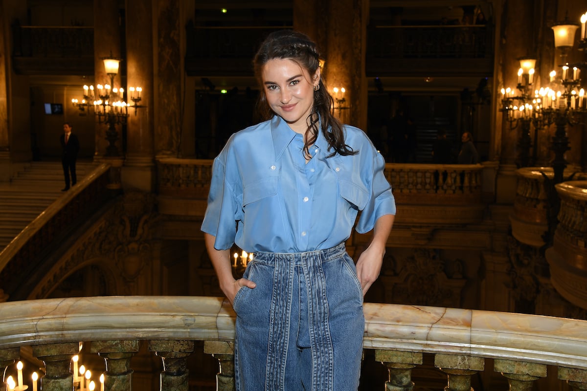 Famous movie star Shailene Woodley wears a blue outfit to a fashion show in France